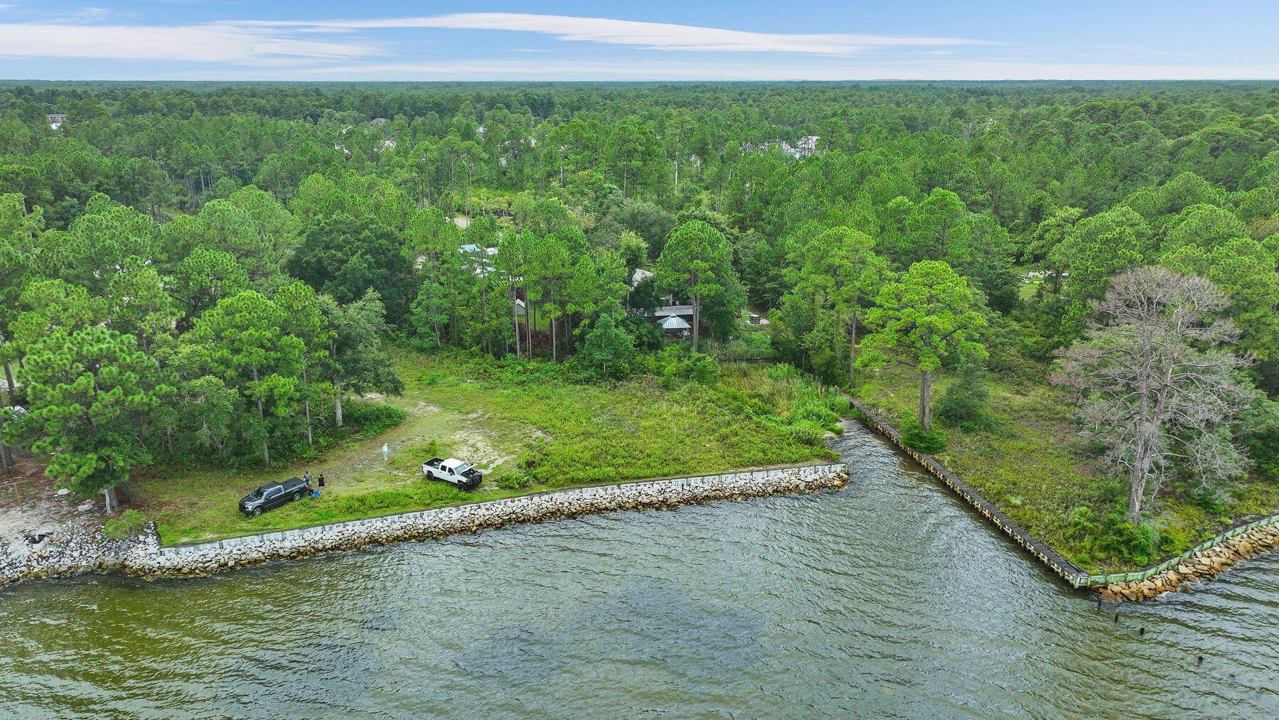 This is two substantial lots of Record recently platted to create a masterpiece development opportunity for two homes or two separate idealized structures in a familial compound estate with 210 feet of Bay Frontage.An opportunity to have two docks, two homes or any other imaginable setting for your family.