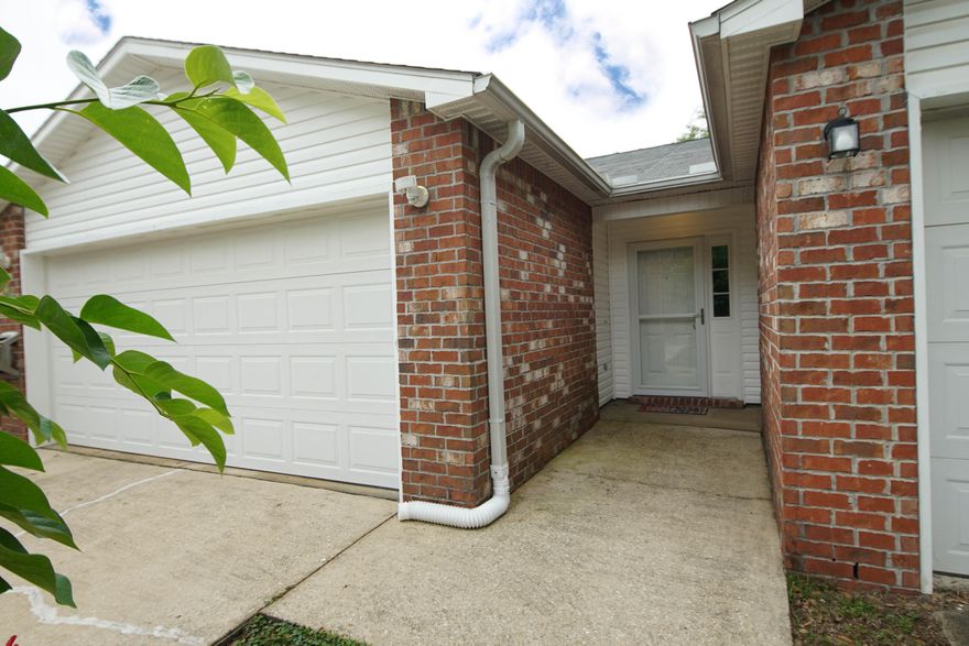 Seller offering home warranty up to $600.00! New updates: Just painted the bathrooms and bedrooms Sherwin Williams Greek Villa White, sodded back yard!  One story townhome in the heart of Fort Walton, FL with 1180 sq ft and a 2 car-garage! This 2 bedroom/2 bath townhome is a perfect home or an INVESTMENT property! Built in 2005 yr there have been many upgrades to include a new roof in 2019, new hot water heater, new gorgeous flooring, updated custom kitchen cabinetry with quartzite countertops and a custom quartzite and tiled back splash! There is an undermount sink with a new kitchen faucet, and a French Door refrigerator (2020)! The bathrooms have many updates to include the vanities and faucets and fixtures. The garage floor has been painted and the garage opener has been replaced The primary bedroom is very large and has an ensuite bathroom and closet. There is a large walk in closet! The primary bathroom features a double vanity and large tub/shower combination. There are raised panel doors throughout. There is a covered patio and extended patio and fenced in back yard. This townhome is homesteaded so the new buyer will get the benefit of a lower tax rate in 2023. There is not a home owner's association and no flood insurance required! The home has two storm doors!  This home is a rare opportunity in Fort Walton Beach! One story town homes are very desirable! Adding a dishwasher to kitchen cabinetry. This home is located close to beaches, schools, shopping, and the military bases! Buyer to verify all dimensions and information. 