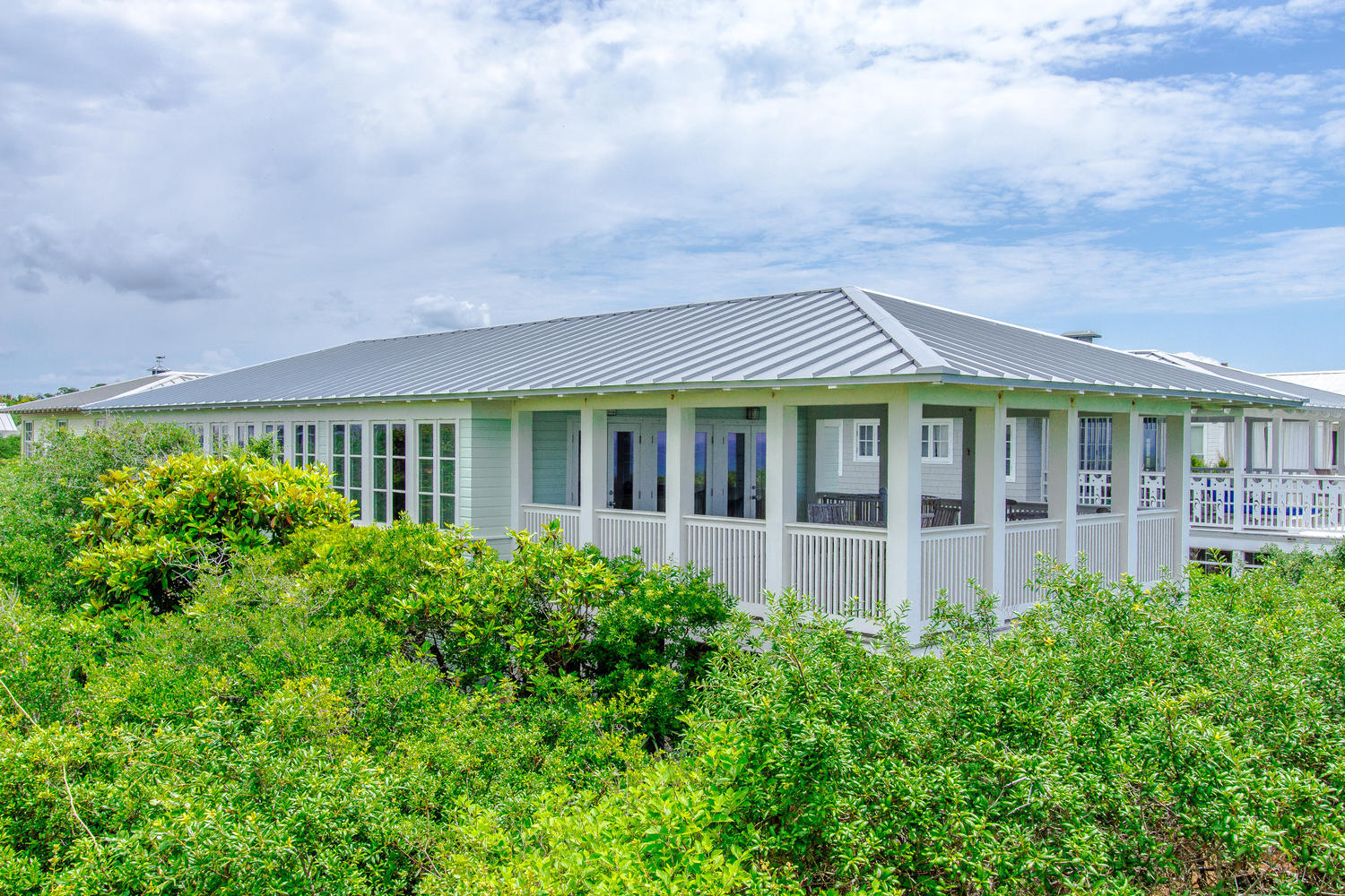 Here is your chance to own in the iconic community of Seaside, FL. This gulf front Seaside home is a 4 BR/3 BA cottage right next to the Odessa Pavilion. You will find three bedrooms on the downstairs floor with the fourth bedroom located off the open living area. A private porch is located off one the downstairs bedrooms, with a spiral staircase connecting it to an open-air balcony overlooking the gulf. Open the three sets of french doors off the living room and enjoy the balcony and the wind off the Gulf of Mexico. A great rental income generator, this home sleeps 11.