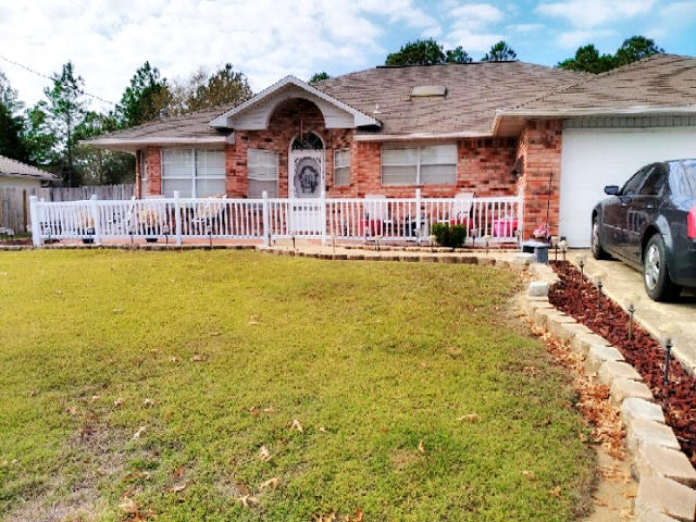 Sellers love shines in this amazing 3 bedroom home. The inviting open front porch to the covered patio and everything in-between. Seller had renovated every room in this home. From the flooring to the unique light fixtures. Your pets are not left out with the state of the art automatic doggie door. Newer appliances, newer AC, New garbage disposal, updated stainless steel appliance, new flooring, new carpet, updated hall vanity and toilet... the list goes on (see feature sheet for all updates). You will not be disappointed with the upgrades or the fully fenced back yard that backs up to the county park. Schedule your private showing today.
