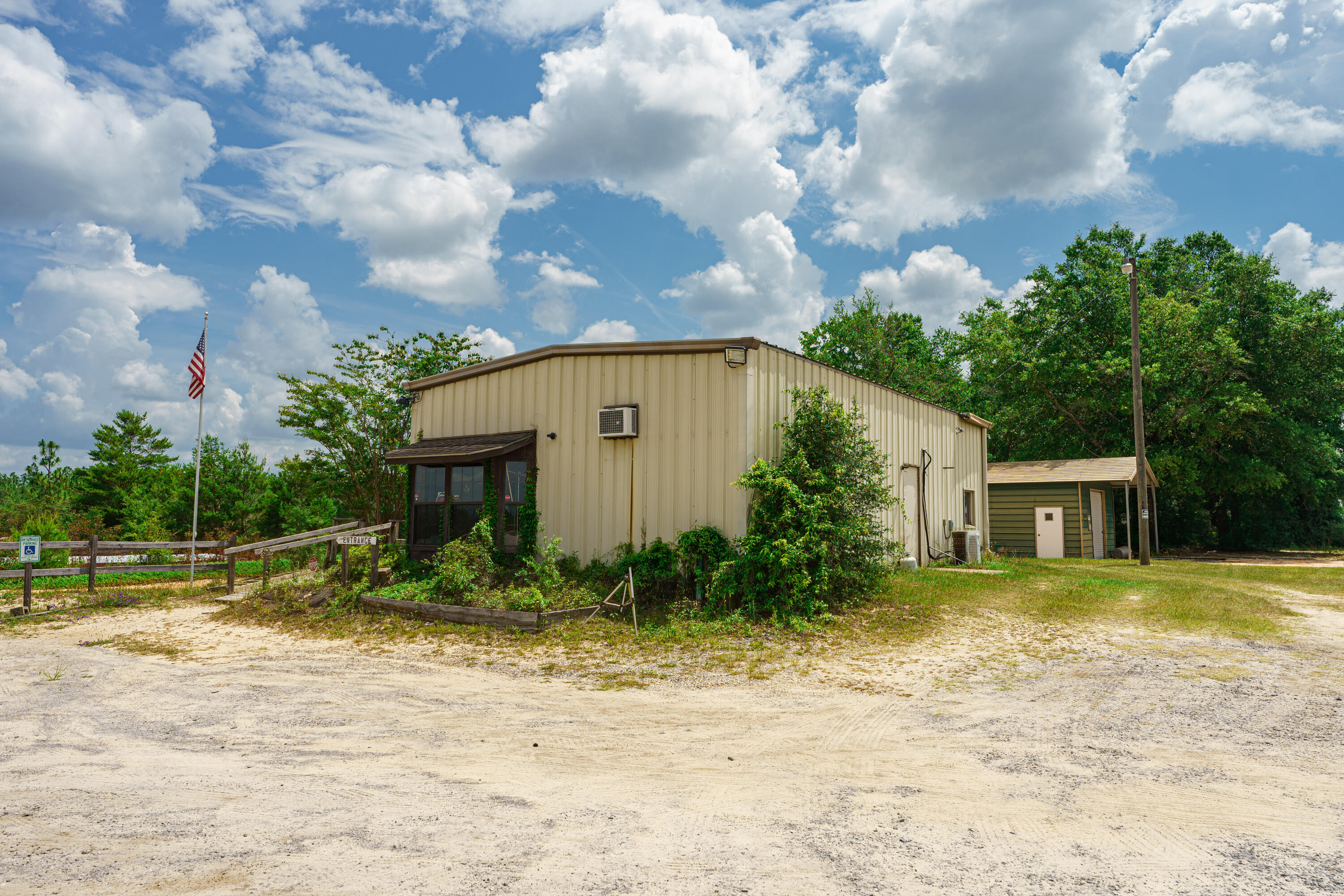 Two parcels make up this 73.7-acre parcel, 7 miles East of Crestview with 1310 feet of highway frontage on Hwy 90E just West of the I-10 exit in Mossy Head~ The property is zoned Commercial and agricultural~ It has been a fully operational Gun Range in the past with a 25-yard 12 station pistol range & a 100-yard 6 station range! There is a creek along the back of the property~ The property is just west of Mt Olive Road and across from the Shoal River Ranch ~  This property has lots of possibilities~
