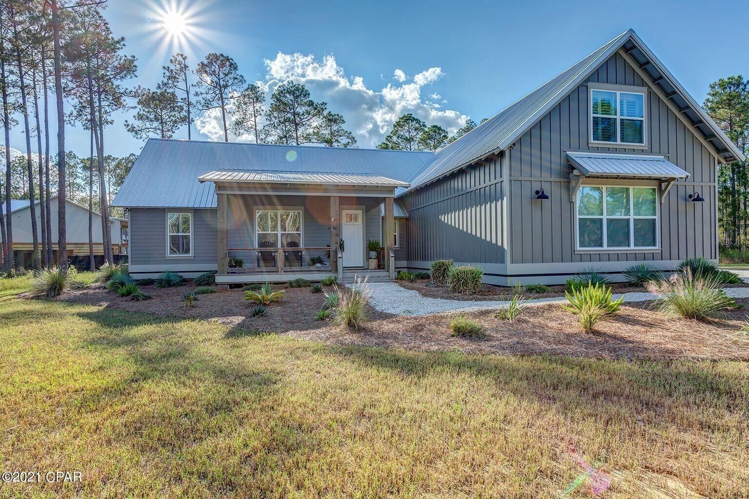 Open House Saturday, October 16th 1-4pm. Looking for a beautiful, large home in an impeccable neighborhood. This possible 5 bedroom 4 bath home has been immaculately cared for and boosts stunning finishes including wood beams, shiplap accents, gas fireplace, quarts countertops, stainless appliances, outdoor entertaining area and more. All situated on a huge (1.26 acre) lot overlooking a pond in prestigious Rivercamps on Crooked Creek. This gated community is a boaters dream, surrounded by three bodies of water, West Bay, the intercoastal waterway, and Crooked Creek. Residents enjoy an array of amenities including a fitness center, zero entry pool, firepit, playground, boat storage, boat ramp, camp ground, bikes paddle boards, 7 miles of trails and boardwalks, just to name a few.