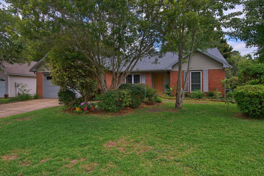 BLUEWATER BAY- Tired of getting in the car to go EVERYWHERE? This gorgeous all-brick home is nestled in the heart of Bluewater Bay- an active community with everything your heart desires a short walk or bike ride away. Whether you are in the mood for fast food or seated service dining you can find it nearby. Or walk to the grocery store and cook out on your large back deck. You can walk to the daycare or the senior care from here or even take your bike for a cruise along Bluewater's oak lined streets down to the marina. This split bedroom home has been nicely updated and is situated on a choice corner lot. Florida room is heated and cooled and is a great place for a studio or craft room! This is a rare find for the neighborhood. Don't miss this one. Call today!