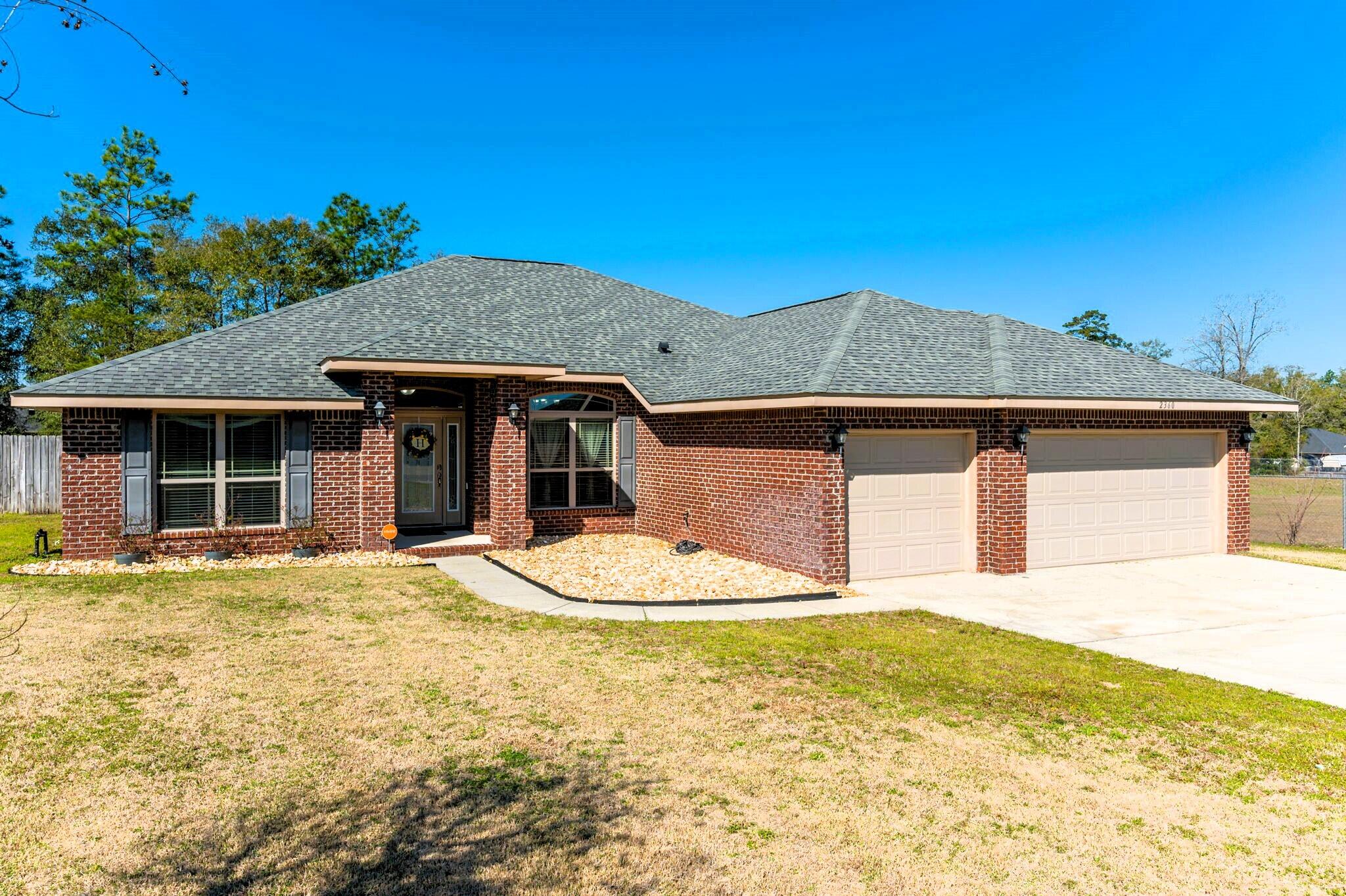 Welcome home! All Brick 4 /3 with 3 car garage situated on a half-acre lot. You are going to want to spend your summer in this gorgeous heated pool with hot tub, sun ledge and waterfall, surrounded by pavers and a 23 x 8 covered lanai, privacy fenced back yard. This split floor plan is well laid out. Kitchen has granite, tiled back splash, stainless steel appliances, breakfast bar and a pantry. Primary suite has 2 closets, 2 vanities, soaking tub and separate shower. New luxury vinyl flooring in kitchen and living areas. Call to schedule a private showing.