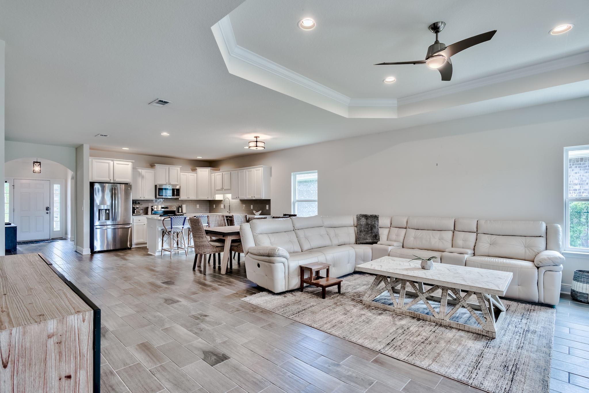Notable upgrades include an aluminum fence for the backyard, irrigation system, screened in porch, extended pavers in backyard, LED lighting throughout, new white quartz countertops, wood plank tile flooring, tray ceilings, crown molding, and many more.New carpet is coming in in June. Washer and dryer conveys. Other furniture is negotiable.
