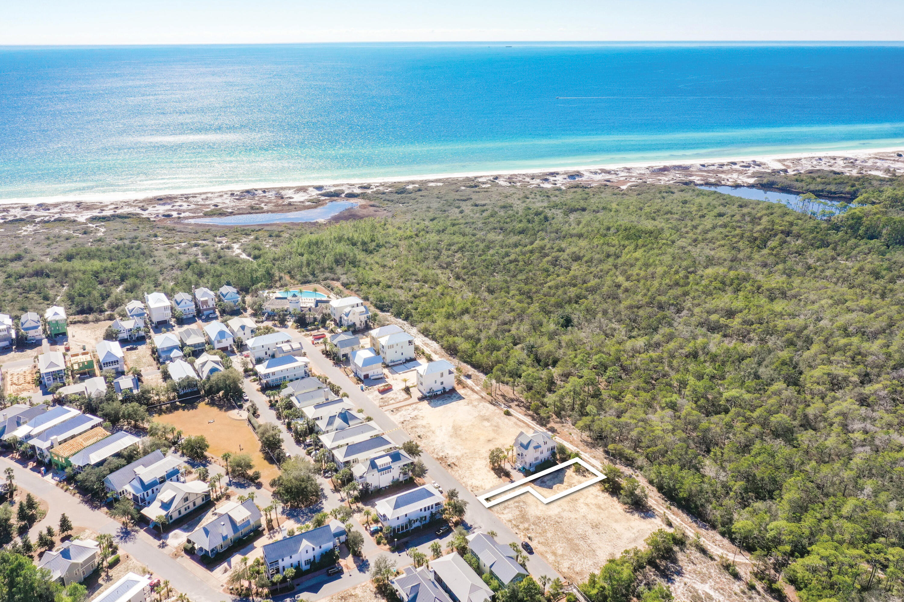 Perfectly located lot backing up to the State Park with potential for a Gulf view from a 3rd floor! Located just one block from an award winning elementary school, minutes from shopping, entertainment, dining and more. This amazing subdivision consists of 44 acres situated 25 feet above sea level and is in an ''X'' flood zone, so flood insurance is not required. Cypress Dunes is known for its landscaping of native plants, a 200 year old Cypress Head, state of the art amenity center, and breathtaking views of a Coastal Dune Lake and the Gulf of Mexico. Cypress Dunes is completely surrounded by Topsail Hill State Preserve which offers 3.2 miles of secluded white sandy beaches, kid activities, nature trails, camp sites The Cypress Dunes amenity center boasts an infinity edged pool, hot tub, workout facility, covered fireplace, 2nd level sunset deck, and an owners party room with a commercial kitchen, all overlooking the Gulf of Mexico! Other amenities include a 2nd pool in Phase 2, boardwalks through the Cypress Pond, tennis courts, and a plush lawn area for recreational use. With a total of 207 home sites, this gated community has the classic Florida Cottage design consistent throughout this unique subdivision. There are a variety of elevations and styles available to choose from if you wish to build a different floor plan. John Willis Homes has a phenomenal reputation built on quality and superior craftsmanship. With over 20 years in the industry, John Willis Homes has perfected the home building experience focusing on luxury, quality and design features that are second to none. The well known Sandestin Golf & Beach Resort is just 5 minutes away with 4 award winning championship golf courses, 15 world class tennis courts, 113-slip marina, water sports and the famous Baytowne Wharf. Grand Boulevard Shopping Center offers a movie theater, Publix grocery, Sacred Heart Hospital, name brand shopping and restaurants like Flemings Steak House, PF Chang's, and Emeril's.
