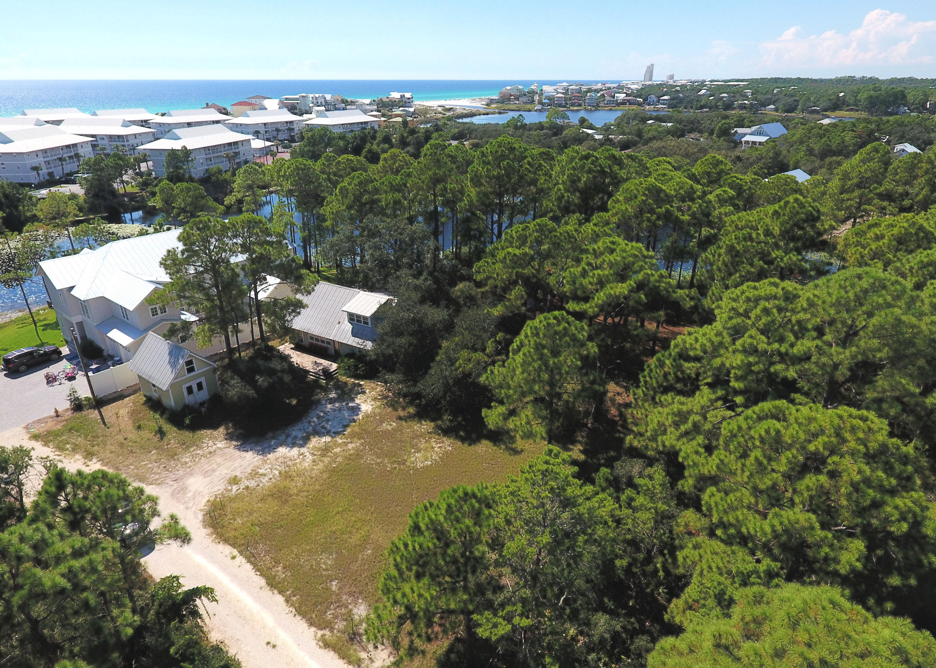 Amazing private location and a very short distance to the beach - approximately 600 yards to the Walton Dunes 2.5 acre Public Park. Also nearanother park which provides a boat ramp and access to Eastern Lake for paddle boarding, kayaking, or boating. The lot fronts Tresca Lake, a small fresh-water lake which does not have the coastal dune lake restrictions. A beautiful place for a vacation or permanent home which provides space to build exactly what you want!