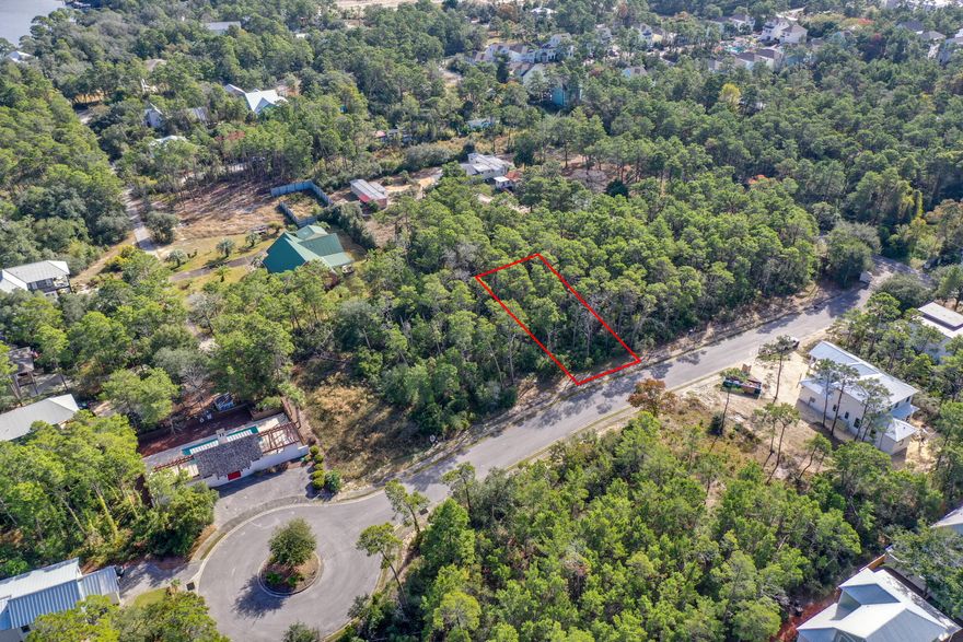 Unique opportunity to purchase a premium lot in the small, private and intimate gated, upscale community of LakeSide at Inlet Beach. Lot 5 is a high and dry, oversized lot at approx. 50' wide x 150' deep with all utility hookups, water, sewer and electric. Lot 5 PineCone Trail is on the east side of this single-street gated community and backs up to a large estate lot. LakeSide at Inlet Beach is quietly set back a casual bike ride or stroll from any major roadway with access to the new Hwy 98 underpass at the Donut Hole being completed for safe and easy access to all the magic 30A offers. This intimate and private 21-lot community, offers a covered swimhouse with pool, fireplace, restrooms and private dock/lake access to the gorgeous coastal estuary Lake Powell. No short-term rental restrictions exist. Reasonable HOA covenants to protect your investment.