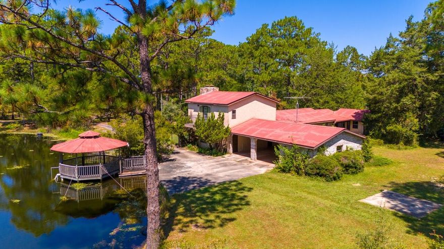 11-acre estate with multiple buildings including a main house, vault room, mother-in-law apartment, shop, toy car shed, blacksmith station, utility metal building, etc. The list goes on. This is a must-see property with a spring fed pond stocked with fish and a gazebo.