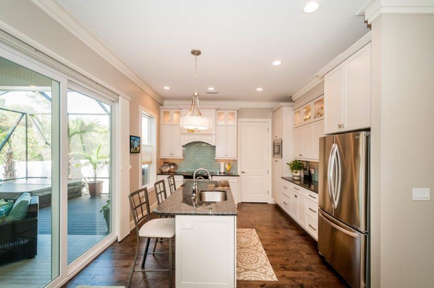 Primary or secondary? THE SEARCH IS OVER! Lovely quality built home (2015) in gated community with deeded beach access. Beautiful home with attention to detail. Exterior and construction: Screened lanai with hot tub, stucco with metal roof, impact glass throughout, drive and walkway with pavers, outdoor shower, Rinnai on-demand hot water system, Rheem HVAC, foam insulation, 2 X 6 construction.
First floor details: 10' ceilings, solid core doors, crown molding, wide plank flooring, Graber window coverings, stainless steel appliances, farm sink, built-in microwave, full-size Whirlpool washer & dryer, soft close drawers and pull-outs in kitchen cabinetry. Unfurnished. Enjoy benefits of foam insulation and impact glass! 2 community pools and 8 min walk to access. Click for upper floor details Two upstairs bedrooms share a Jack and Jill bath with tub-shower combination, linen closet, and dual vanities. Rooms have ceiling fans.  Buyers will appreciate the large, shelved storage on this floor. The 2-car garage contains built-in cabinets, additional storage, a workbench, and a utility sink.
Quality pervades this home.   Call today for a private showing and exclusions.. (Buyer to confirm all fees, measurements, and additional information.)