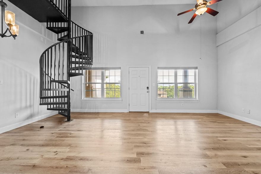 Location, Location, Location! This spacious 1,915 sq. ft. two-story condo is centrally located in Destin, just minutes from the stunning Emerald Coast beaches. Nestled next to City Market Bayside and The Destin ER, and conveniently positioned between Destin Commons and Silver Sands Outlets, this home offers the best of shopping, dining, and coastal living at your doorstep.Step inside to soaring 20-foot vaulted ceilings, creating an airy and open living and dining space. The kitchen overlooks the living area with a breakfast bar, perfect for casual meals and entertaining. A spiral staircase leads to the spacious loft, which features an en suite bathroom with a stand-up shower, bathtub, and walk-in closet--plus a BONUS ROOM that can be used as a bunk room or extra storage. Downstairs, the large suite offers direct balcony access through French doors and features an en suite bathroom with a double vanity, walk-in closet, stand-up shower, and relaxing jacuzzi tub. Another guest bedroom also opens to the balcony, while a third full bathroom in the hallway ensures convenience for guests.