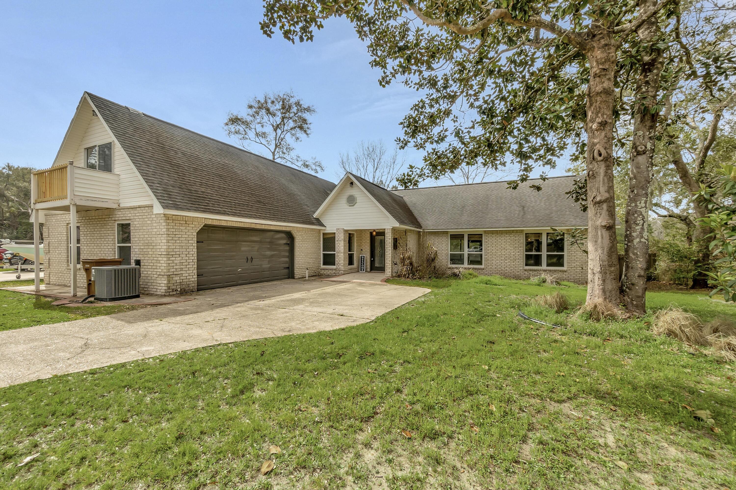 Waterfront home on Lake Robledal in the highly sought after community of Robledal Estates. This bright and inviting 5BR/4BA home boasts new LVP flooring throughout and includes a bonus room with an en-suite bath over the two car garage. Spectacular views of Lake Robedal can be viewed from the open and expansive great room with vaulted ceilings and wood burning fireplace. Create memorable meals while taking in the water views in this well-equipped recently updated kitchen featuring stainless steel appliances with a Bosch double oven, tiled backsplash, custom live edge breakfast bar, and open shelf pantry. The spacious Owners Suite overlooks the water and has trayed ceilings, a walk in closet, two additional closets, and porch access.