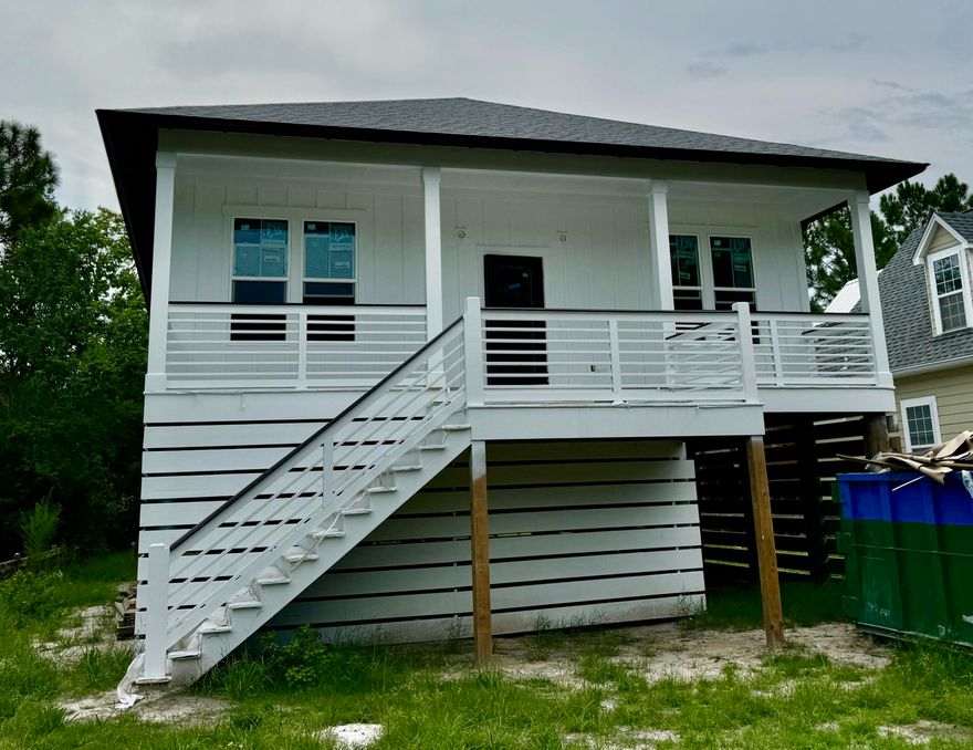 Under construction. No HOA and just a few miles from the beach! Close to the boat ramp at Hog Town Bayou.Parking underneath, perfect for storage. All info is deemed accurate, buyer to verify.