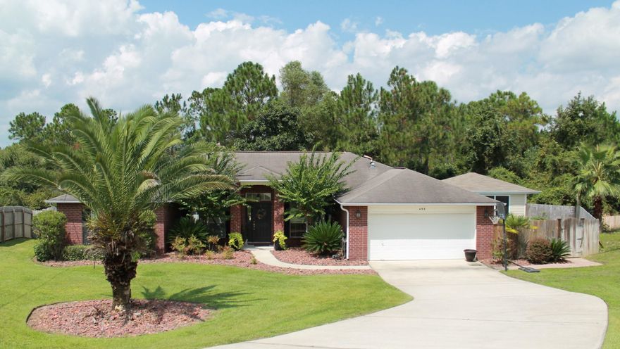 Relax at home w/your Private Retreat! In-ground POOL, Screened Cabana w/Grill, TV, and Mini Fridge, Tiled Pergola w/Balcony and Wooded View, Playground, Paver-stone walkways, and LUSH landscaping! SOUTH of I-10 with a 1 YR home warranty, IMMACULATE one owner home w/CURB APPEAL! Wood flooring throughout w/carpet in the additional bedrooms, upgraded fixtures, granite vanities, elevated ceilings, WHIRLPOOL appliances, media wiring throughout, oversized tile, and MUCH MORE! Office and Dining Room flank the Foyer and opens up to the Living Room w/French Doors to your Beautiful Backyard. Eat-in Kitchen is located off the Living Room. Fully equipped Kitchen w/stainless appliances, breakfast bar, and tons of cabinet/counter space! Schedule your viewing!