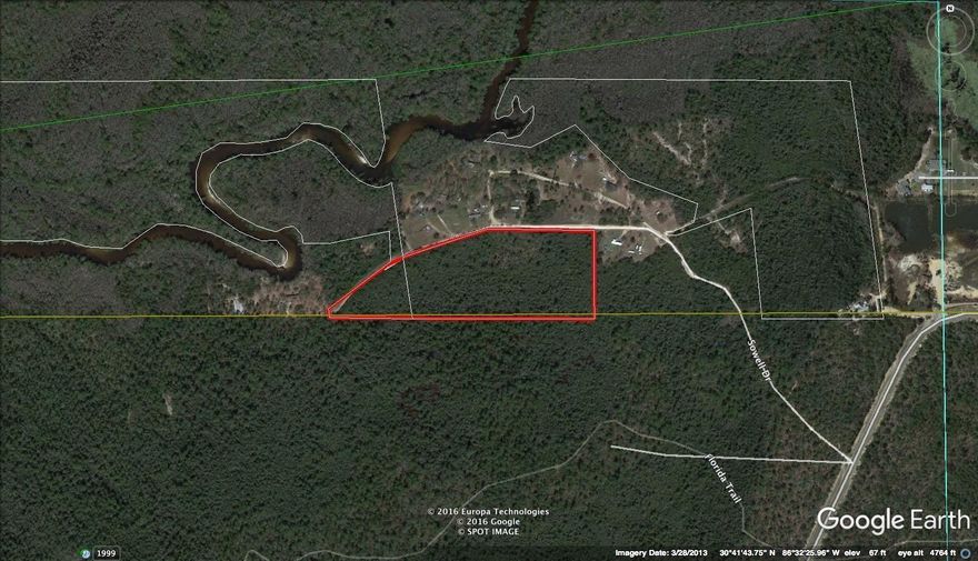Are you looking for a place to build your dream home with lots of privacy?  Check out this 13.36 acre parcel near the Shoal River.  The property is located in South Crestview and close to Eglin AFB and the 7th Special Forces.  This area  would be a great hunting property.   The Seller has a survey, a wetland survey, an elevation certificate  and a permit for a septic tank available.   The property has a water well and electricity and 1.6 acres has been cleared and is ready for you to build your new dream home or park your RV.  The shipping container and RV on site do not convey.