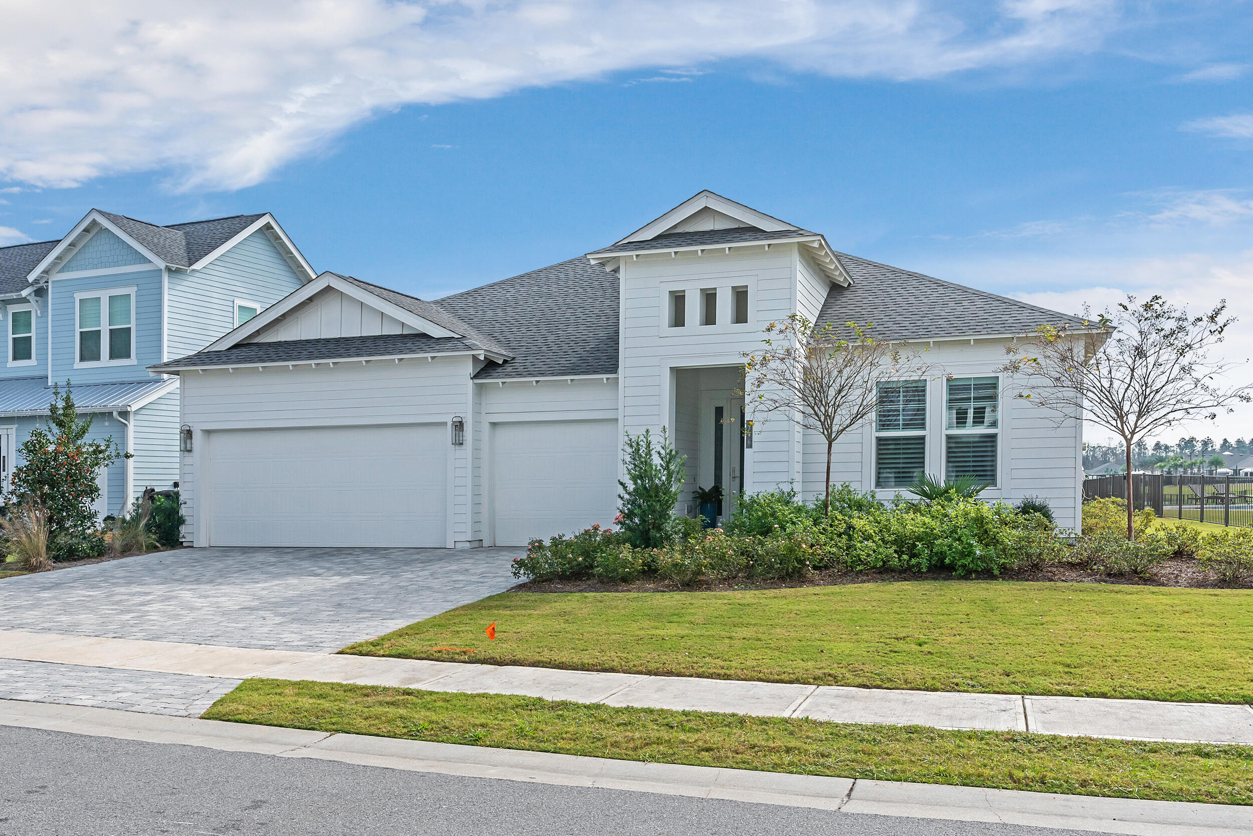 This stunning Panama floor plan, spanning 2,388 square feet, offers luxurious waterfront living with an exceptional design and thoughtful upgrades. The home features three spacious bedrooms, three full baths, and a versatile office or den, all complemented by a three-car garage and a driveway wide enough to accommodate easy golf cart access.The kitchen is a masterpiece of elegance, boasting upgraded cabinetry with 18-inch lighted upper cabinets, while the living area features a cozy fireplace. Step outside to discover a custom heated pool and spa, surrounded by high-end, low-temperature decking, and an outdoor kitchen equipped with a grill, sink, and fridge--perfect for entertaining. The expansive lanai, complete with retractable privacy screens, extends your living space, creating a seamless indoor-outdoor experience.
Throughout the home, upgraded flooring and a high-efficiency HVAC system enhance comfort and style, while custom plantation shutters and curtains provide timeless charm. The thoughtful layout includes a secondary bedroom with its own private bath, and a laundry room equipped with a sink and additional cabinetry.
NatureWalk is the only gated community within Watersound Origins and the amenities are exclusive for NatureWalk residents only while also having access to all of the Origins amenities.  This means residents have access to a vibrant resort-style community center featuring a large pool, hot tub, fire pit, bar area with TV, pickleball and tennis courts, and a state-of-the-art fitness center. Residents also enjoy unlimited golf, kayaking on Lake Powell, and events on the Origins event lawn. Situated at the east end of the iconic 30A corridor, just minutes from the Gulf's pristine beaches and the upscale dining and shopping of Alys and Rosemary Beach, this home combines coastal convenience with serene beauty, making it an unparalleled retreat.



