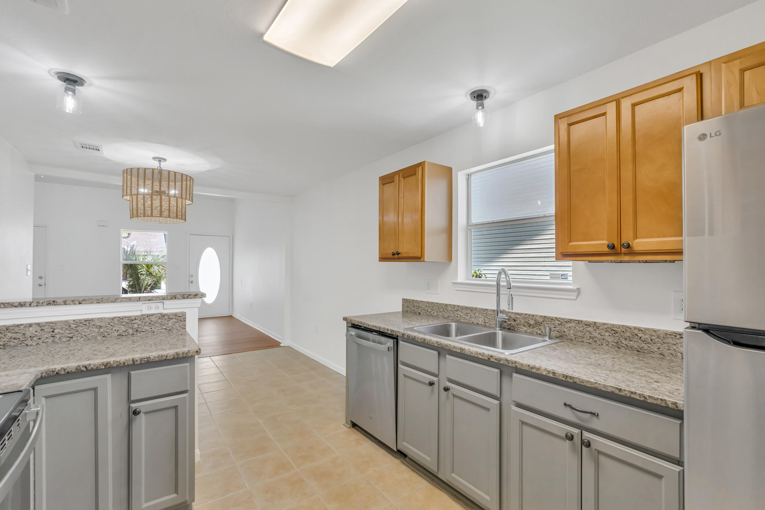RENOVATED 3BR/2BA Townhome located in the heart of Destin featuring a first-floor primary suite, one-car garage, and private patio. Recent upgrades include new paint, flooring, carpet, stainless appliances, custom tile in the primary bath, updated lighting, and 2024 HVAC & water heater. Enjoy community pool access and easy proximity to the beach, shopping, and dining. Move-in ready and full of charm--schedule your showing today!