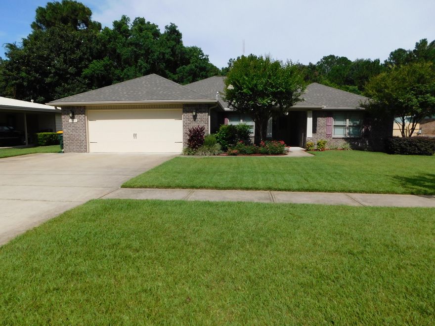 LIKE NEW!!!! 5 BEDROOM, 3 BATH Home with over 2700sf in Central Fort Walton Beach! This spacious home has amenities galore! All Brick with a Hip Roof! Durable, high-end wood look Laminate flooring in the living room and tile in the foyer, kitchen and all wet areas. Tankless Gas Hot Water heater provides endless hot water! The Large Eat-Kitchen has a bright Breakfast nook and features Wood Cabinets, Granite Counter Tops, Stainless Appliances, Gas Stove, Large Walk-in Pantry, Breakfast Bar and Built in Microwave. The Living Room is over 25ft long and opens to the Covered Lanai. There is a Formal Dining Room as well. The Oversized Master has a Trey Ceiling and TWO Walk-in Closets! The Master Bath has a Faux Marble double vanity, a separate shower, garden tub, water closet & linen closet.