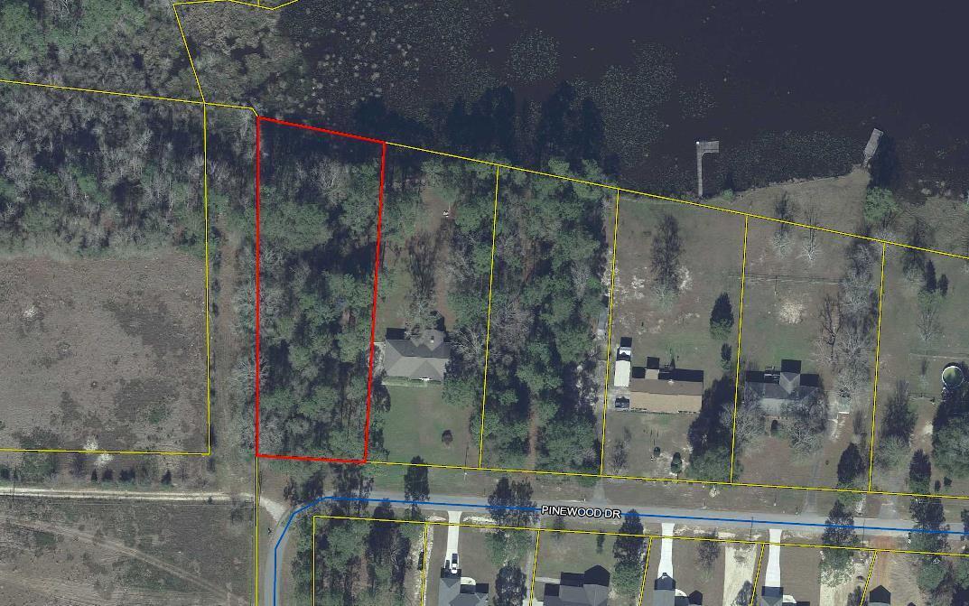 HARD TO FIND -- Large (over one acre) waterfront lot in Beautiful Ten Lake Estates. This wooded lot slopes gently down to the water at the very end of the biggest lake in the subdivision. There are some very large trees on this lot -- clear as much as you like and build your dream home. No mobiles allowed in this almost built-out subdivision only 5 miles north of DeFuniak Springs, and only 35 miles to the sugar-sands the Gulf of Mexico! HOA is optional
