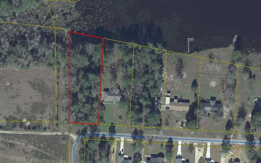 HARD TO FIND -- Large (over one acre) waterfront lot in Beautiful Ten Lake Estates.  This wooded lot slopes gently down to the water at the very end of the biggest lake in the subdivision.  There are some very large trees on this lot -- clear as much as you like and build your dream home. No mobiles allowed in this almost built-out subdivision only 5 miles north of DeFuniak Springs, and only 35 miles to the sugar-sands the Gulf of Mexico! HOA is optional