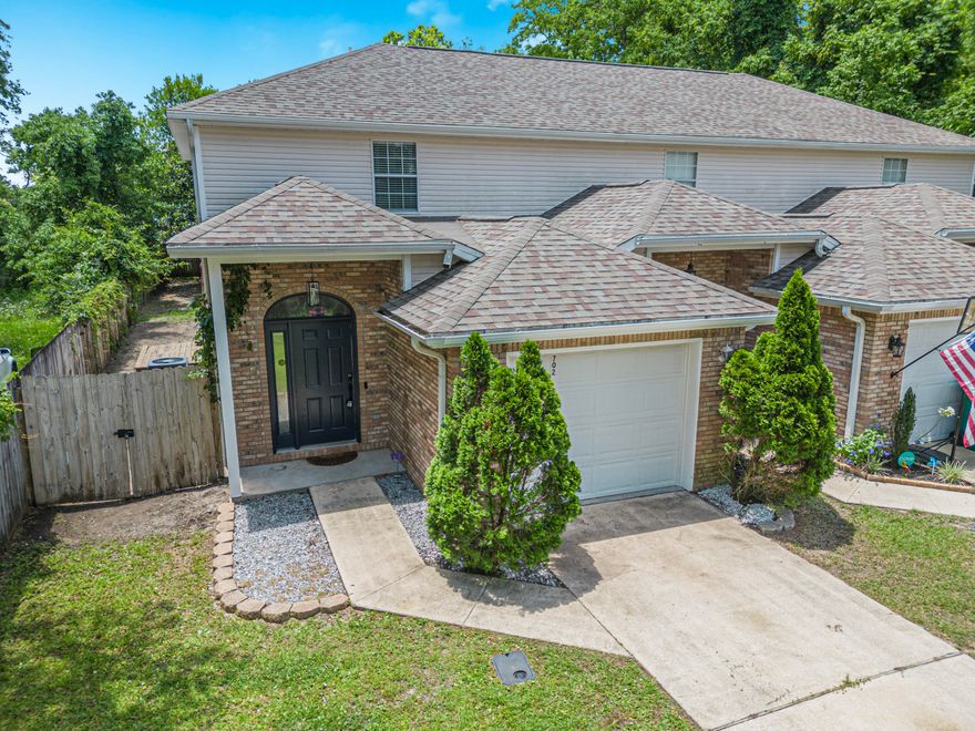 Welcome to this delightful end-unit townhouse offering the perfect blend of comfort and modern living. As you enter through the raised foyer ceiling, you will immediately appreciate the open and airy feel of this home. The main floor feature an inviting open concept layout with a nice kitchen boasting a breakfast bar, perfect for casual dining.  The adjoining dining area seamlessly flows into the spacious living room, ideal for entertaining guests. Additionally, a convenient half bath on this level also house the laundry room. Upstairs you will find two generously sized bedrooms, each with double closets and their own private bath.  Step outside to the large, privacy-fenced backyard with an oversized patio.  This home is a true gem.