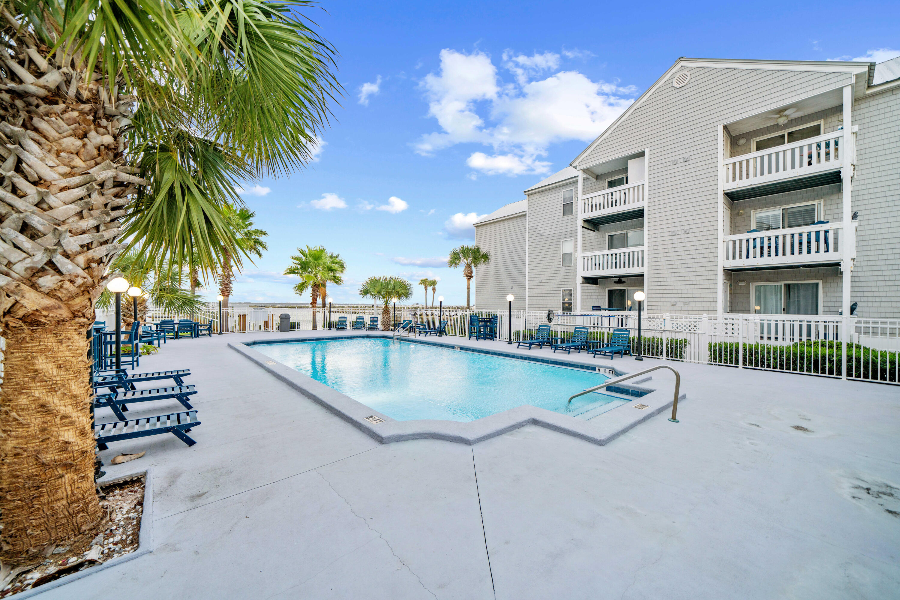 ***Assumable 2.25% interest loan. Welcome to Unit 311 at the Hermitage Condominium on Okaloosa Island in Fort Walton Beach. This beautiful 2-bedroom, 2-bathroom condo is located in a charming Bayfront community of just 42 units, offering a serene coastal lifestyle.EXCEPTIONALLY RARE BOAT SLIP #2 IS INCLUDED with this unit, providing unparalleled access to waterfront living.