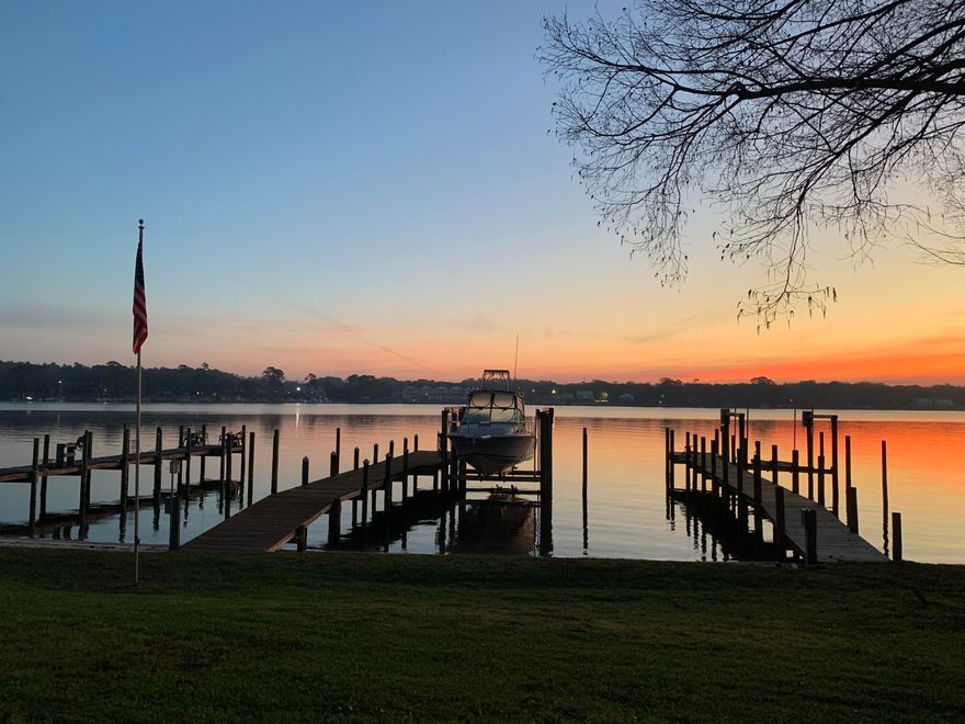 Well renovated townhome with Roof 2022 and HVAC 2020! Enjoy breathtaking views of Boggy Bayou from this beautifully appointed townhome, thoughtfully designed with both style and functionality in mind. The interior showcases upgraded flooring throughout, a well-appointed kitchen featuring stainless steel appliances, quartz countertops with custom edging, and bespoke cabinetry. The main level offers a convenient laundry area with space for full-size machines, a stylish half bath ideal for guests, and a one-car garage. Step outside to the back porch, where you'll find a charming backyard with a beach area and access to a shared dock--perfect for enjoying waterfront living.

Upstairs, the primary suite captures stunning water views and features a private balcony, along with a full bathroom complete with a tiled shower. An additional full bathroom also includes a tiled shower, upgraded vanity, and added storage. Two additional bedrooms provide comfortable accommodations with ample space.

This exceptional property blends refined finishes with serene coastal living. 