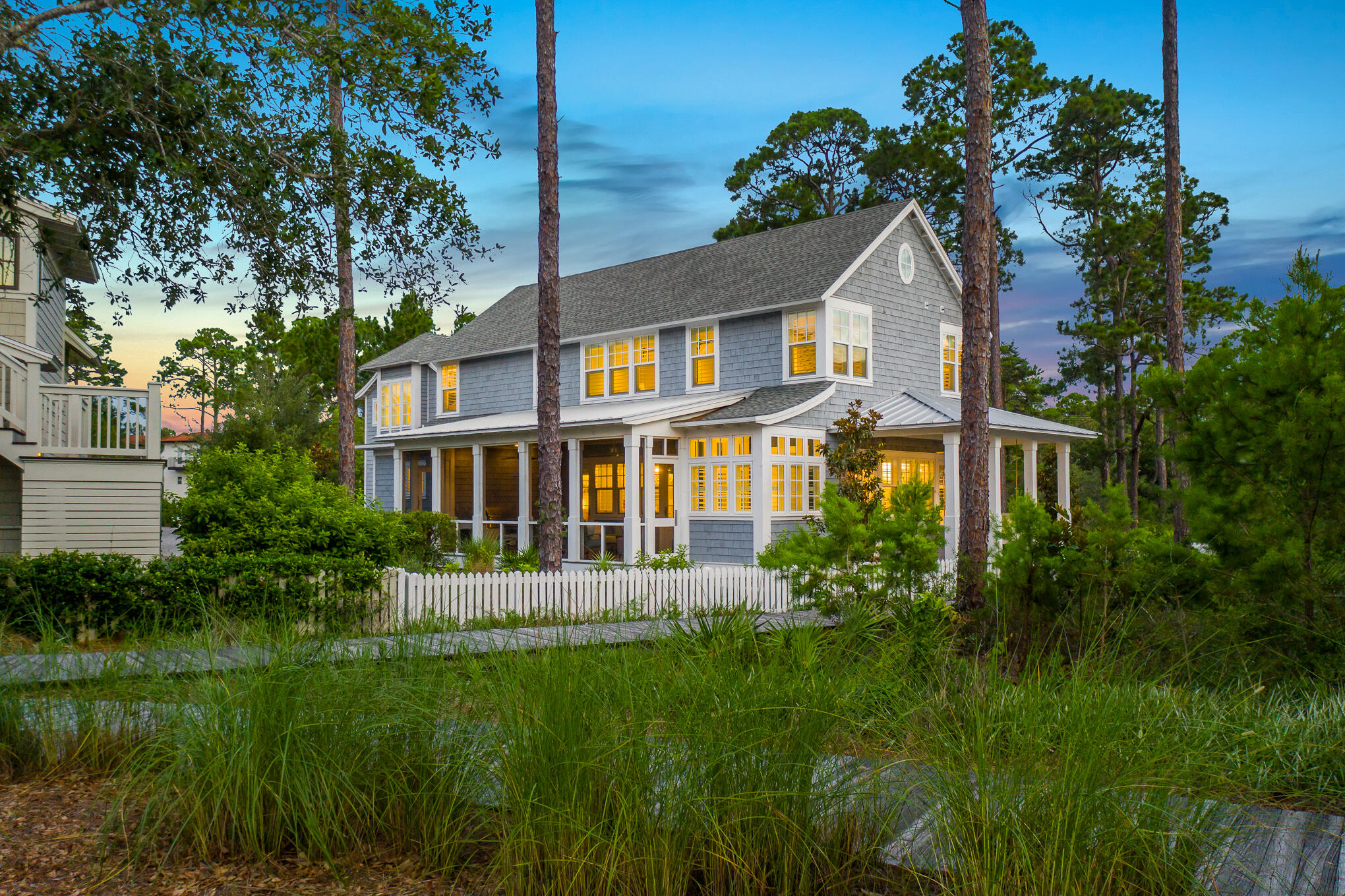 Gorgeous home in Watersound West Beach! Comfortable beach living at its finest is on display in this beautiful beach house.  At 3,568 sq. ft. of living space, complete with 4 bedrooms and 4 1/2 baths, plus an additional free-standing carriage house, this home offers plenty of room for the whole extended family, and thoughtful design features create a sense of relaxed luxury throughout.  The first floor boasts a well-appointed chef's kitchen, open floor plan, and a luxurious primary suite with spa bathroom that includes an oversized soaking tub, steam shower, and double closets.  Upstairs offers two additional bedrooms with ensuite baths, as well as a bunk room that includes 4 bunk suites. The carriage house features a two-car garage with plenty of storage and the additional 4th bedroom