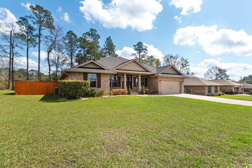 Our popular Craftsman 2202 floor plan offers 2,202 square feet of thoughtfully designed living space, featuring 4 bedrooms and 2 full bathrooms. This spacious layout includes a cozy breakfast nook just off the kitchen, as well as a formal dining room perfect for hosting special gatherings. The kitchen opens seamlessly into the large family room, creating a warm and inviting atmosphere ideal for everyday living and entertaining. A separate living room provides flexible space that can easily function as a home office, playroom, or additional sitting area to fit your needs. Enjoy outdoor living with both a generous covered front porch and a covered back porch. The back porch is conveniently accessible from the family room, the primary bedroom, and bedroom #4 -- making it especially functional for families with children or pets. This home is loaded with upgrades, including durable vinyl flooring throughout all rooms and granite countertops in both the kitchen and bathrooms. The spacious primary suite features a luxurious bath with a separate shower and a relaxing garden tub, complemented by a window above for beautiful natural light. Additional exterior enhancements include four-sided brick construction, professional landscaping, a full irrigation system, gutters, and a private backyard enclosed by a privacy fence with attached pest and wildlife control fencing. For added security and peace of mind, the home is equipped with a full alarm system, including front and back cameras, a Ring doorbell, and sensors on all windows and doors. Motion-activated flood lights in the backyard provide extra visibility and security at night.