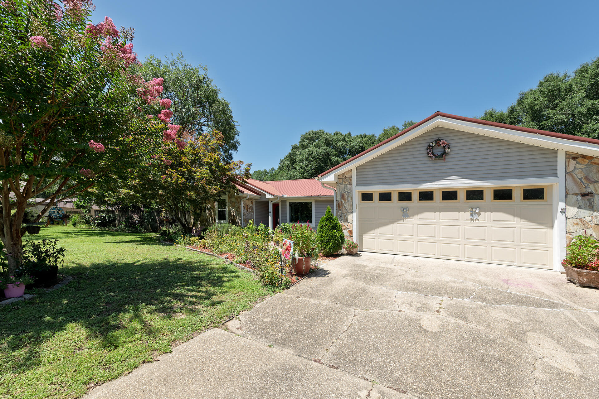 A Gardeners Paradise featuring 6 Apple Trees, a Lemon Tree, 2 Pear Trees, 2 Plums, Blackberries, Blueberries, Persimmons, Grapes, & so much more! Gorgeous, picturesque landscape from this 3BR/2BA, 1,935SF Home on over an acre of land. This home features a new HVAC, appliances, LVT flooring, & hurricane rated windows with a lifetime warranty. Other features include freshly painted interior, updated Pex plumbing, & a new electrical box. The home is open with a split floor plan, Florida room, & large living space with fireplace. Located north of Crestview and only a short drive to shopping, restaurants, & entertainment. No HOA fees & no taxes for 2025. Do not miss this opportunity to own your dream home!