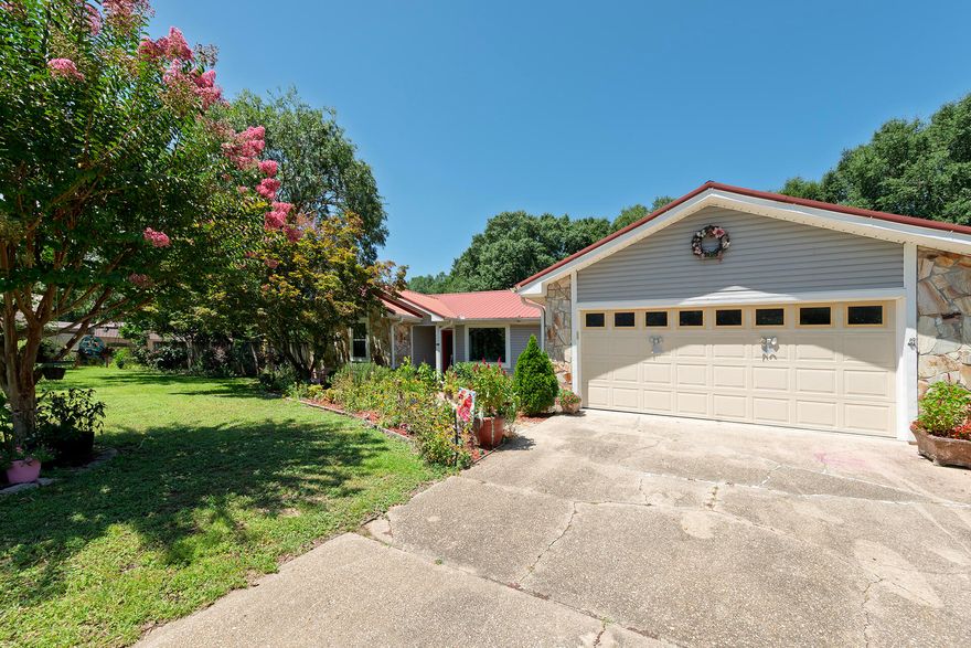 A Gardeners Paradise featuring 6 Apple Trees, a Lemon Tree, 2 Pear Trees, 2 Plums, Blackberries, Blueberries, Persimmons, Grapes, & so much more! Gorgeous, picturesque landscape from this 3BR/2BA, 1,935SF Home on over an acre of land. This home features a new HVAC, appliances, LVT flooring, & hurricane rated windows with a lifetime warranty. Other features include freshly painted interior, updated Pex plumbing, & a new electrical box. The home is open with a split floor plan, Florida room, & large living space with fireplace. Located north of Crestview and only a short drive to shopping, restaurants, & entertainment. No HOA fees & no taxes for 2025.  Do not miss this opportunity to own your dream home!