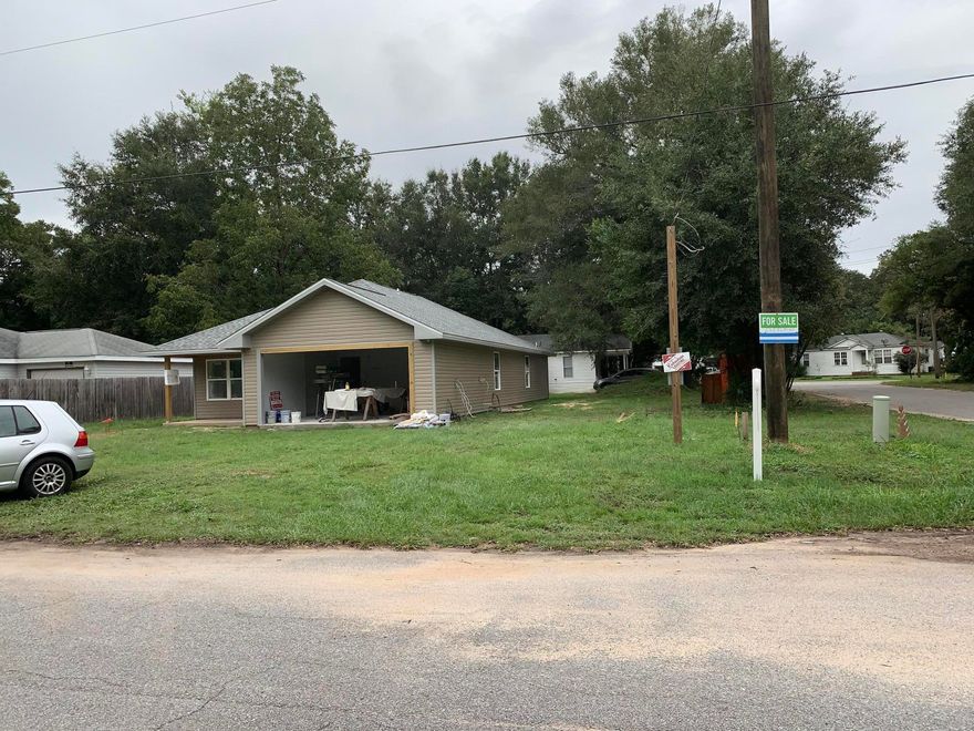 NEW CONSTRUTION! Completion date middle of October. Beautiful custom home on large corner lot.   3 bedrooms 2 bath. Great open floor plan with tile throughout except in bedrooms. Master bedroom has 2 walk-in closets and bathroom with double granite counter tops.. Kitchen will feature an island and grey tones for cabinets and granite . Front and back patios. better pictures as construction completes. estimated completion date middle of October.