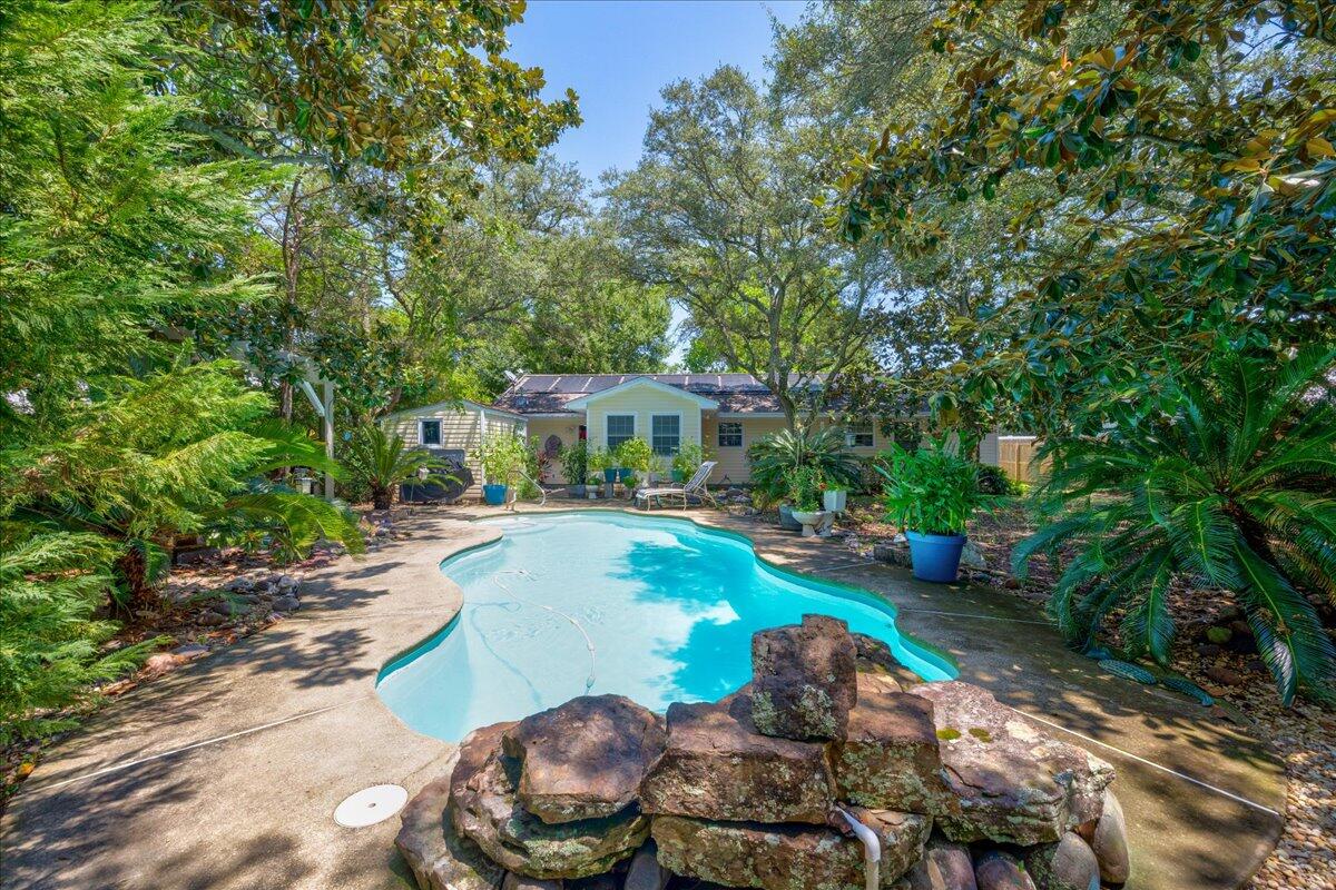 Welcome to your Destin retreat! This 3 bed, 2 bath home sits on over a quarter acre and features a brand-new roof, HVAC, and water heater for peace of mind. Enjoy your own private oasis with a sparkling pool surrounded by lush landscaping, perfect for entertaining or relaxing. A rare bonus, the property includes a fully functioning woodworking shop with machinery and tools included, offering endless creative possibilities. This move in ready home blends comfort, upgrades, and lifestyle in one incredible package.