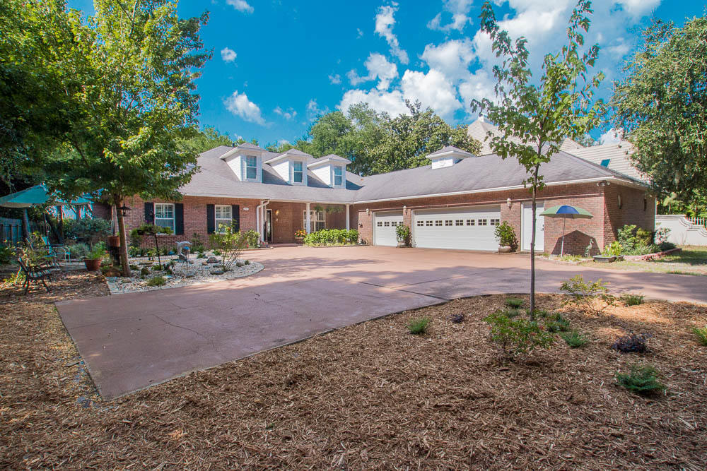 CURRENTLY UNDER CONTRACT. Now taking back up offers. Special Note: Two Master Bedrooms on Ground Floor! - Imagine having your own slice of paradise, right on the bayfront in beautiful Destin, Florida. Imagine waking up in a lavish master suite, with gorgeous antique-style furnishings and and your loved one beside you. Imagine brewing your morning coffee against a dazzling backsplash imported from Turkey, in the kitchen of your dreams. Imagine watching the morning news before a cozy gas fireplace, with surround sound enveloping you and panoramic views of the bay just to your right. Imagine getting ready for the day with vibrant travertine tile beneath you and granite at your fingertips, with newly upgraded lighting illuminating the bathroom mirror in front of you. Imagine stunning guests with lush bedrooms, antique-style furnishings and decor, a private exercise room, exquisite architecture, and gorgeous natural landscaping. 
Imagine stepping out of your back door and being only feet away from the bay, in all its splendid glory. Imagine sitting on your own private dock with your toes in the crisp, cool water, watching the boats go by. Imagine being out on your own boat, coasting across the bay with the sea breeze in your hair, all with home still in view. Imagine coming home after a night on the town and driving through your private gate, exchanging the bustle of the town for an environment of bliss and joy. Imagine watching the sunset cast rainbows on the serene water from your patio or screened in porch, warm cup of tea in hand. 
Imagine being able to wake up the next morning and do it all again, and again, and again. All of this, and more, is possible when you make this tranquil bayfront property your home. Call today to schedule an appointment to meet your dream home. 
