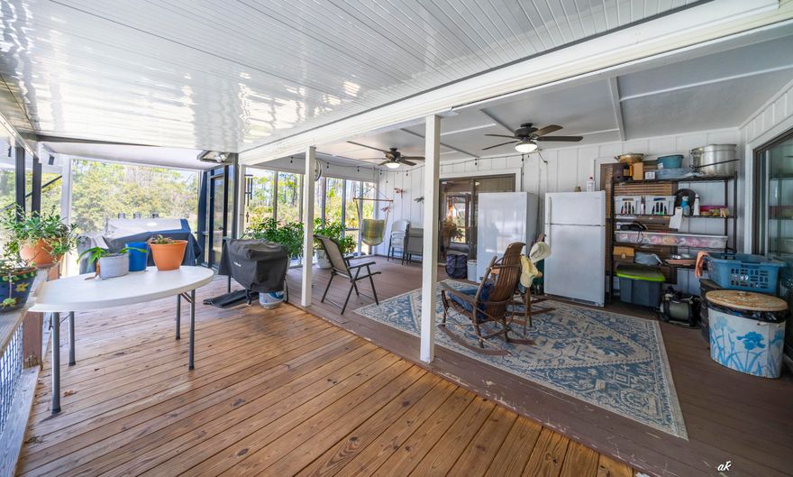 Kings Point Harbour, one of Panama City's most convenient and established neighborhoods. This well-maintained 3-bedroom, 2-bath home offers over 2,000 square feet of heated and cooled living space, designed for both everyday comfort and entertaining. What truly sets this property apart is the additional 1,000+ square feet of covered outdoor living, creating a private backyard retreat that feels like an extension of the home. Step outside to enjoy a fully screened pool and porch area featuring an in-ground heated pool, spacious covered seating areas, and plenty of room for outdoor dining and entertaining. The screened enclosure allows you to enjoy the outdoors while staying cool during the summer while keeping the space comfortable and enjoyable year-round. Inside, the floor plan offers both openness and flexibility. The family room centers around a gas fireplace that produces substantial heat, creating a warm and inviting gathering space. The kitchen features custom-built wood cabinetry, generous storage, and convenient access to both the formal dining room and a bright breakfast area for more casual meals. A dedicated study or home office provides a quiet workspace, ideal for remote work, reading, or managing daily life. The primary suite includes an updated bathroom with his and her vanities, offering both comfort and functionality. Two additional bedrooms and a second full bath provide flexibility for family, guests, or hobbies. The home sits on nearly half an acre, offering space, privacy, and room to enjoy the outdoors. The landscaped yard and mature surroundings add to the property's curb appeal while maintaining the relaxed coastal lifestyle that makes this area so desirable. Bonus features worth noting include an updated water heater, HVAC system, Brock Pest termite bond, a 2 car garage, and a large driveway providing ample parking for family and guests. Another major advantage is the freedom of living in a neighborhood without an association to answer to. Kings Point Harbour is known for its central location and everyday convenience. From this home you are just minutes from Publix, Sam's Club, ALDI, HCA Florida Gulf Coast Hospital, and only a short drive to the Hathaway Bridge for quick access to Panama City Beach. Homes in this neighborhood rarely combine size, outdoor living, lot space, and location this well. If you've been looking for a property that offers room to live, room to entertain, and the convenience of everything close by, this home deserves a closer look.