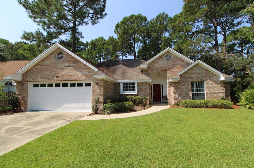 WALL TO WALL COMFORT! Welcome home to your all brick home situated in the heart of Destin. Step inside the tiled foyer to find a wonderful open floor plan. Spacious living area with raised and vaulted ceiling, gas corner fireplace and windows that span across the back of the home and a door that leads out to the screened-in pavered patio. Dining area opens into the living room making entertaining a breeze. Light and bright kitchen with lots of cabinets and counterspace, breakfast bar and pantry. Master bedroom with a deep window and door that leads out to the patio. Master bath has an extended double vanity, whirlpool tub, separate shower and a walk-in closet. Split bedroom floor plan allows additional privacy from guests and children. Two additional bedrooms and a full bath