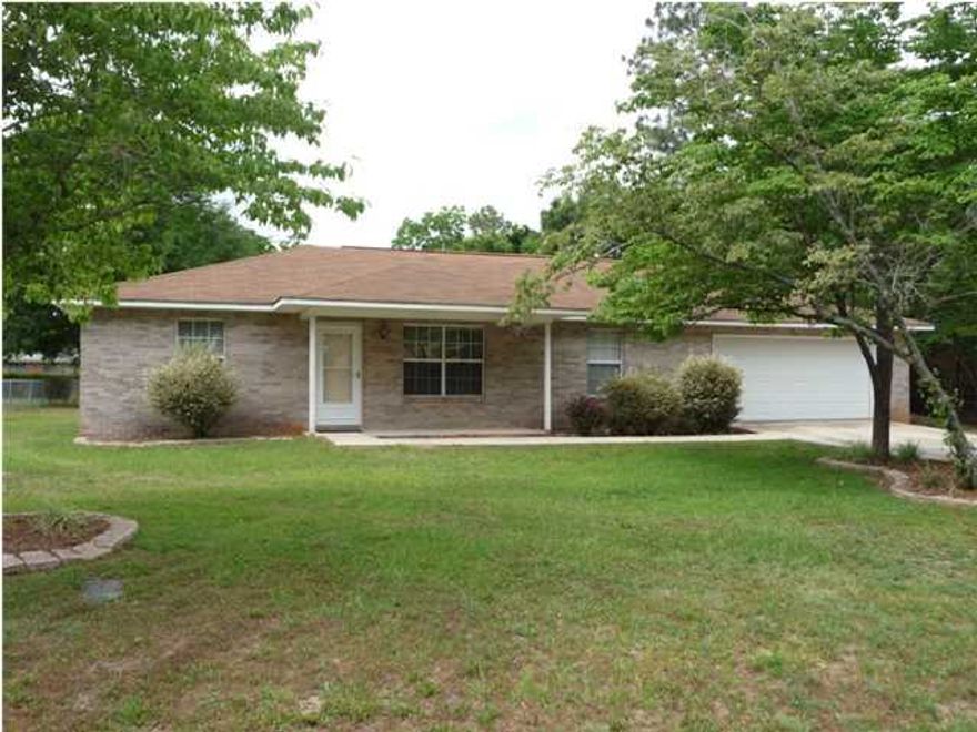 Short Sale..Lovely Brick home on a level lot in the center of Crestview. Close to downtown, the well kept home has 3 bed 2 bath with a beautiful fireplace, Large Garage, Huge back yard with a shed, plenty of room on the side of the house to drive in the back yard if needed. This is the perfect home if you are looking for house that is move in ready and close to the elementary school, middle school and high school.