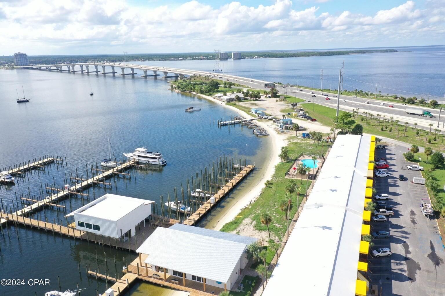 The new owners have rebuilt Sun Harbor Marina on St. Andrew Bay. Located on the east end of the Hathway Bridge adjacent to the Port of Panama City. The two-story restaurant space is now available for lease. The framing is completed and the landlord plans to deliver a 'vanilla-shell' space per the attached plans. The monthly rent is $5,000 NNN, plus operating expenses, and 7% of annual gross sales in excess of $857,413. The tenant improvements are negotiable and the landlord will finish-to-suit. The space is designed to have the main dining room and kitchen on the second floor with additional seating on the wrap around outdoor decks. The first floor includes additional bars, seating, entertainment, bathrooms and storage areas. The second floor is accessed via an ADA ramp. The most  incredible views all year. Easy access and plenty of parking. A roof-mounted sign would be visible from the Hathaway Bridge and St. Andrew Bay. Sun Harbor Marina is home to the Schooner Columbia and the boat slips are now leasing. The fuel dock is also open. This location will have tremendous visibility and a lot of traffic by boaters, too. Call for further details and to setup a tour.