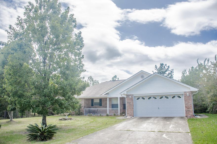 This charming all brick home on 1.19 acre lot has been meticulously maintained. Located just 6 miles east of downtown Crestview, this lovely home has an open concept floor plan and split bedrooms. The well appointed kitchen, which includes the refrigerator, overlooks the spacious family room complete with a vaulted ceiling, plant ledge and lots of windows to allow for natural light. Plenty of room for entertaining or just relaxing. An open patio off the back door provides a great place for grilling out. The yard is amazing! Total privacy! Fruit trees and camellias are scattered throughout while a yard building will hold all your gardening tools. Make sure you put this home on your list, you won't be disappointed!!