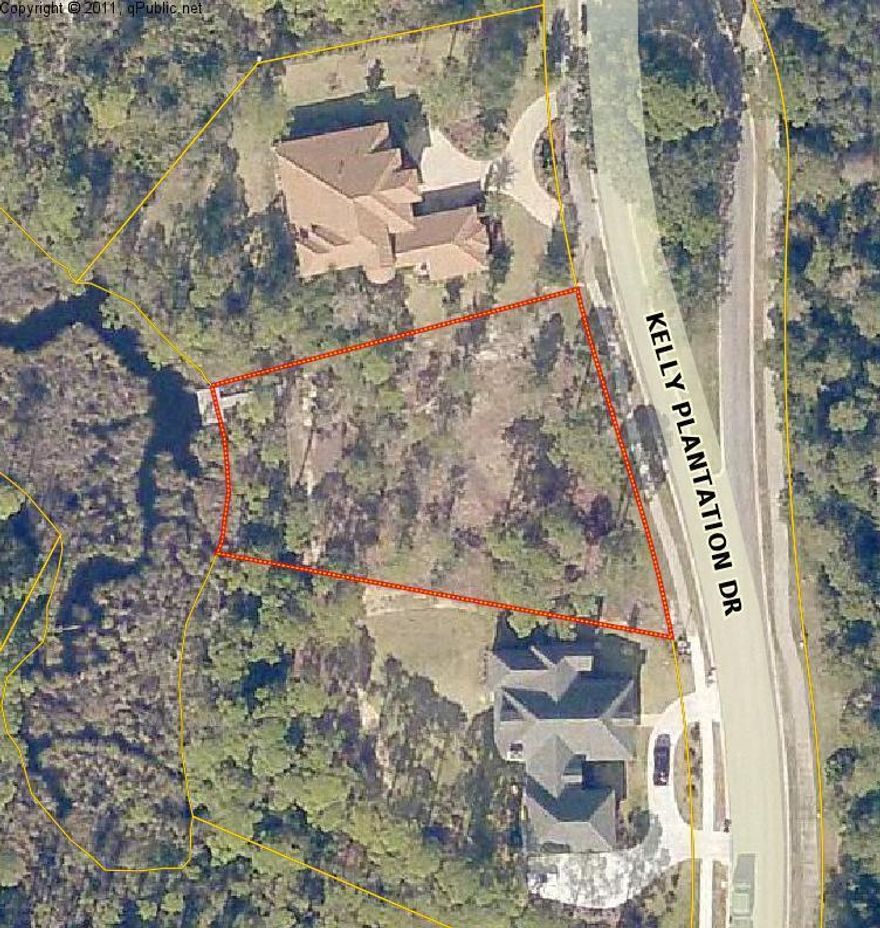 Bank Owned!! Looking for an exceptional lot just steps away from the clubhouse, tennis courts, pool, fitness center and restaurant in one of the area's most outstanding gated communities. The rear of this half acre lot has a bulkhead and dock at its frontage, enhancing access and views of the very southeastern tip of Jones Bayou, fronting an open access taking you through Jones Bayou all the way out into the bay - ideal for kayaks, paddle boards, etc. Across the street from this homesite is the #1 hole to the Championship Fred Couples Golf Course. What a perfect place to build your dream home.