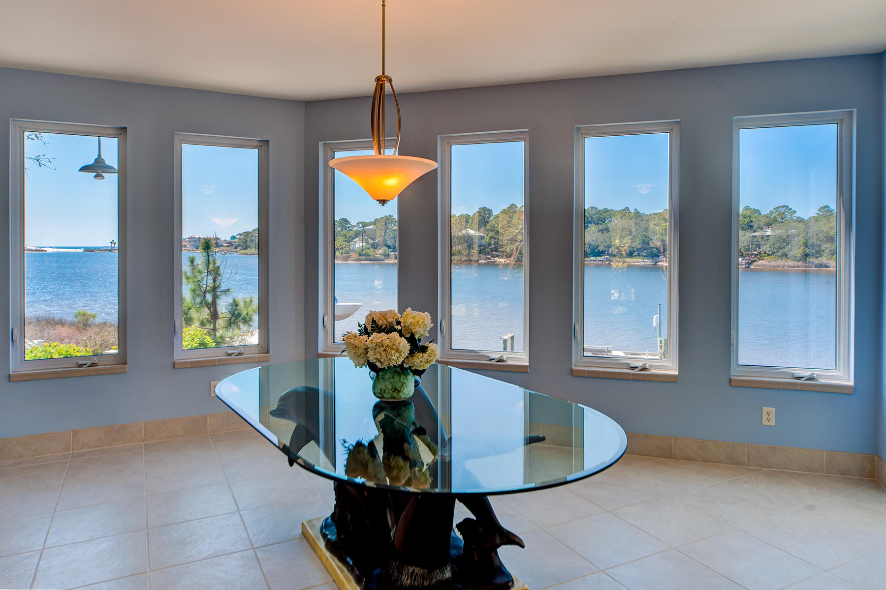 Walking into this lovely home you view across the expansive windows on main level of living room into the pristine Eastern Lake and down to the Gulf through the Inlet. This home has million dollar views and is in great shape offering three bedrooms, three baths and an oversized garage with extended driveway and additional parking pads to the north side of house.Lifestyle on the the Eastern Lake is one of the most enjoyable experiences for a family to use stand up paddle boards, canoes, kayaks and water skiing on the Coastal Dune Lake! Views to the GULF through the Inlet are seen from each room in the house.