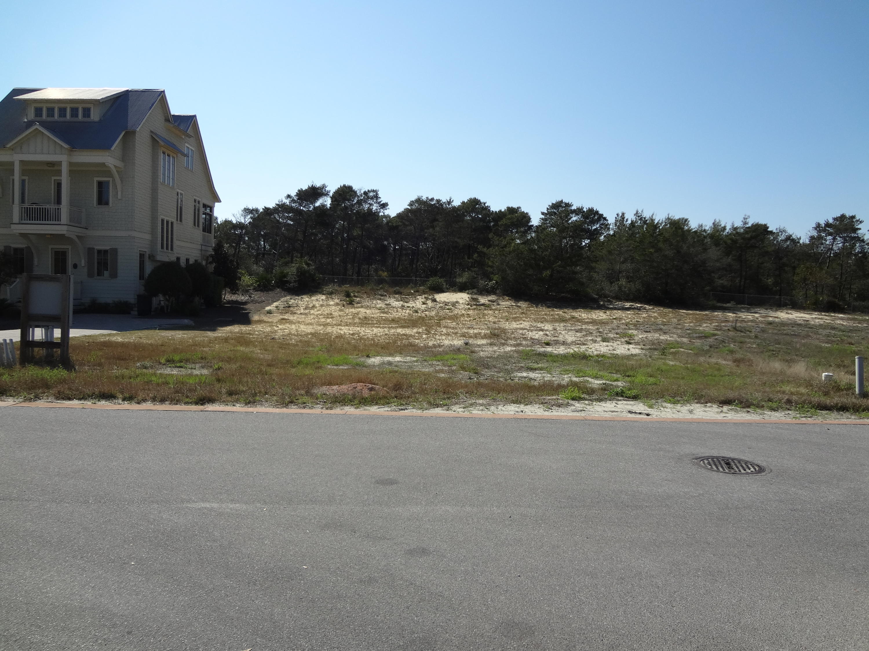 This lot is located just south of the board walk crossing the Cypress Head! Great Location and equally near both Phase I & Phase II Pools! You have the privacy of a gated community, nature at its best with the beautiful gulf, dunes and state forest views from the fabulous Life Style Center and the beautiful 200+ years old Cypress Head that is unique to this community! Infinity edge pool, fitness center, over sized hot tub, outdoor living area with fireplace and a viewing deck for those beautiful sun sets! Plus Clay Tennis Courts and a second pool in Phase II. Combine all this with custom construction by John Willis Homes and you have a real winner! See this lot today; it is situated to be equally convenient to the pool in Phase I and Phase II! Buyer should verify all information