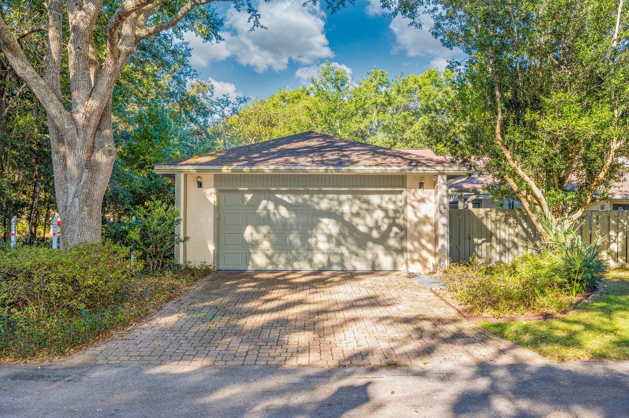 Welcome home to 900 Bay Drive Unit 62, a perfectly located SINGLE STORY, 2-CAR GARAGE, END UNIT in the peaceful, garden setting of Bluewater Bay's Royal Oak Village. This patio home promises easy, low maintenance living with abundant space and many upgrades! Discover and enjoy two of everything - two ample-sized bedrooms, two baths, two spacious living spaces, two private, sun-soaked patios, and a rare, ATTACHED 2-car garage featuring a convenient, separate golf cart entrance as well as built-in cabinetry, shelving, and counter space for storage and work. The tidy kitchen boasts a full suite of newer stainless-steel appliances, solid-surface countertops, and tumbled stone backsplash. Find a flexible den adjacent to the formal dining area with a custom window seat and storage! Recent improvements include a new garage door, HVAC, programmable thermostat, vinyl plank flooring in the secondary bedroom, toilet in hall bathroom, Live Oak fiber internet, and more. Royal Oak Village enjoys a prime location placing all of Bluewater Bay's resort amenities within easy reach - pools, tennis and pickleball, golf, marina, miles of walking trails, restaurants, shopping, and health care. Bluewater Bay is zoned for top-rated Niceville schools, offers an easy commute to Eglin AFB, Duke Field, 7th Group, EOD School, and all of the natural beauty and entertainment across the Mid Bay Bridge in Destin and South Walton. Do not wait to call this your new home! 

