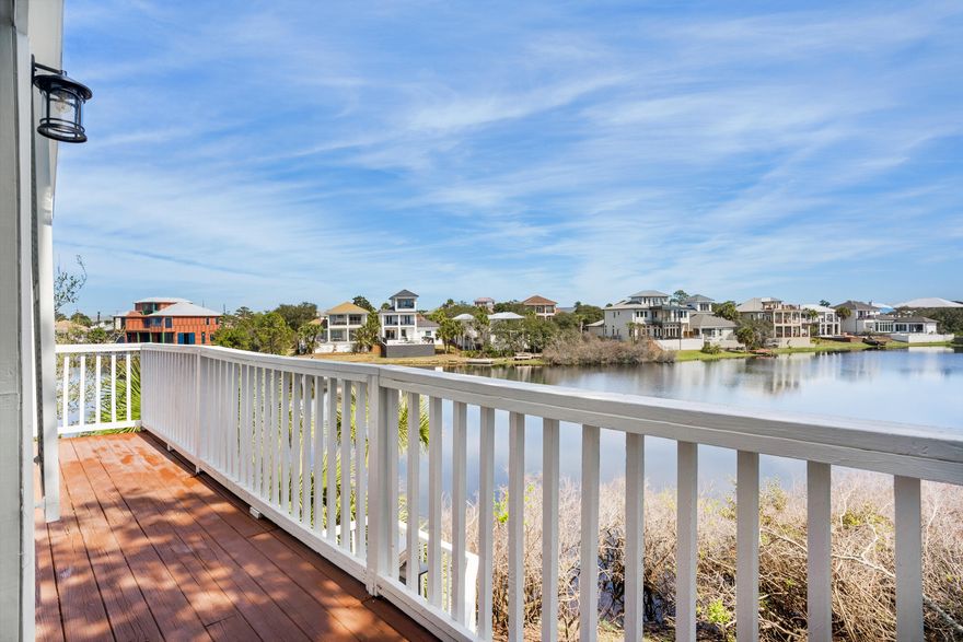 Your waterfront dream w/ wrap-a-round balony is here and features private beach access! This spacious and stunning remodeled 3-bedroom, 3 bath lakefront beach house is nestled in a serene Destin cul-de-sac and features both modern amenities and architectural character in a fantastic and highly desirable beach community. The top-of-the-line kitchen boasts endless countertops, storybook white cabinetry, and stainless steel appliances. All rooms have been professionally decorated w/ alluring coastal decor and furniture. Relax near the fireplace and unwind. This luxurious home showcases an immaculate waterfront 2nd floor master bedroom w/ private balcony. Your family, friends and vacationing guests will never want to leave. The lakefront location is a true nature lover's paradise and just 500ft from private beach access. This serene retreat features lazy oak trees providing cool shade and a sense of tranquility. Enjoy the blissful surroundings, with stunning lake views and the soothing sounds of nature all around. Whether you're lounging by the water, exploring the nearby private beach, or simply unwinding under the trees, this backyard offers the perfect blend of relaxation and natural beauty. Your personal haven awaits!