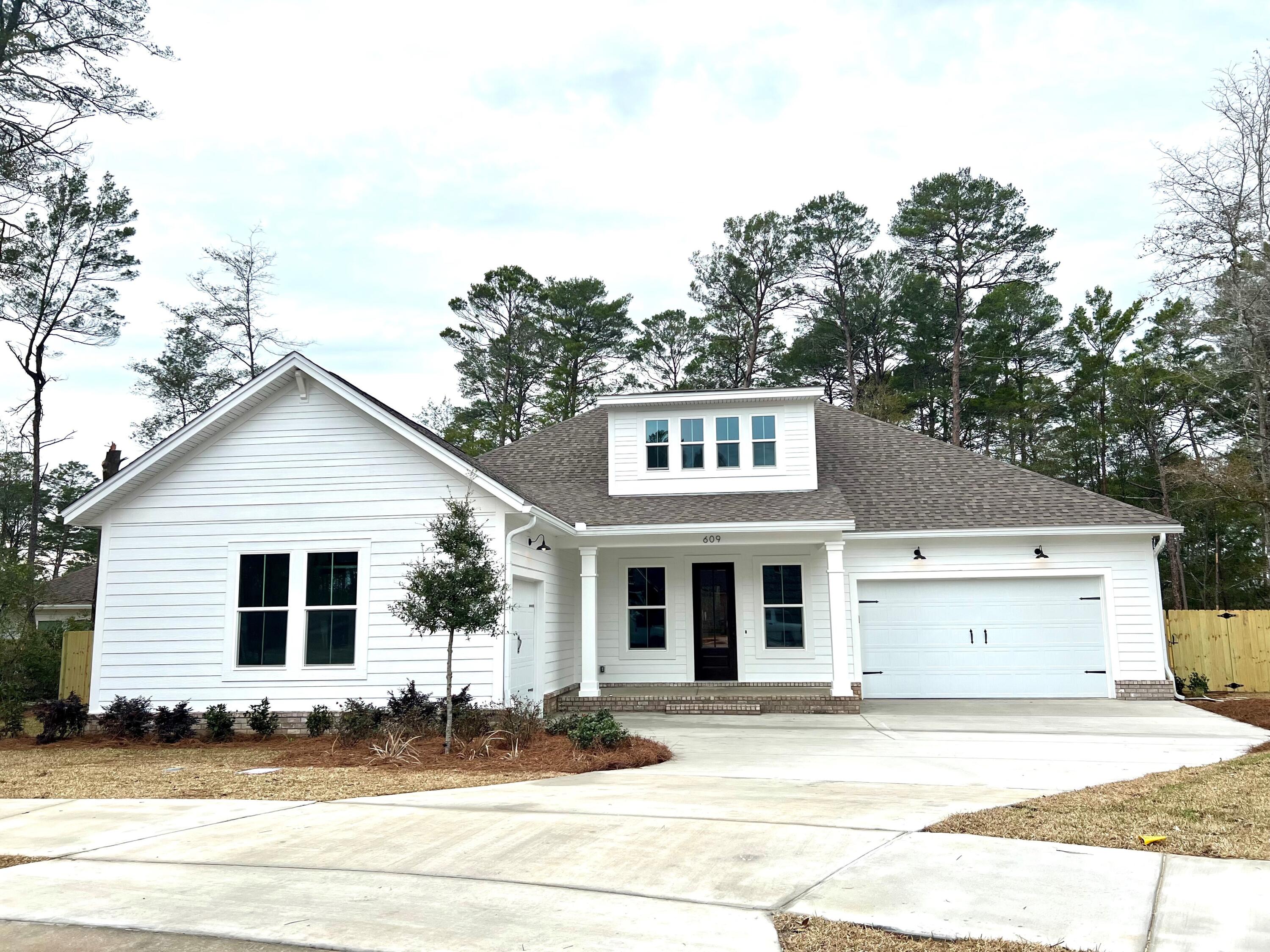 BRAND NEW, 3 Car, Florida, Craftsman- Style home for sale in Ph 2 of DEER MOSS CREEK, Niceville's largest and newest subdivision.3 bedrooms downstairs w/ an upstairs 4th bedroom/bonus rm, loft , 3 1/2 baths plus a pocket office. 2 car oversized garage plus, a 1 car Garage. Home is nestled in a cul-de-sac in the center of the neighborhood. This home boasts 10 ft ceilings downstairs and all wood shaker cabinets and engineered hardwood in the main downstairs living areas. Custom built in closets and pantry. Tankless hot water heater, Deer Moss Creek is a master planned , front porch community w/ charming, single family homes & future commercial properties set amongst tree lined lots & walking paths. Ph 2 will have a pool, clubhouse and basketball ct and park.