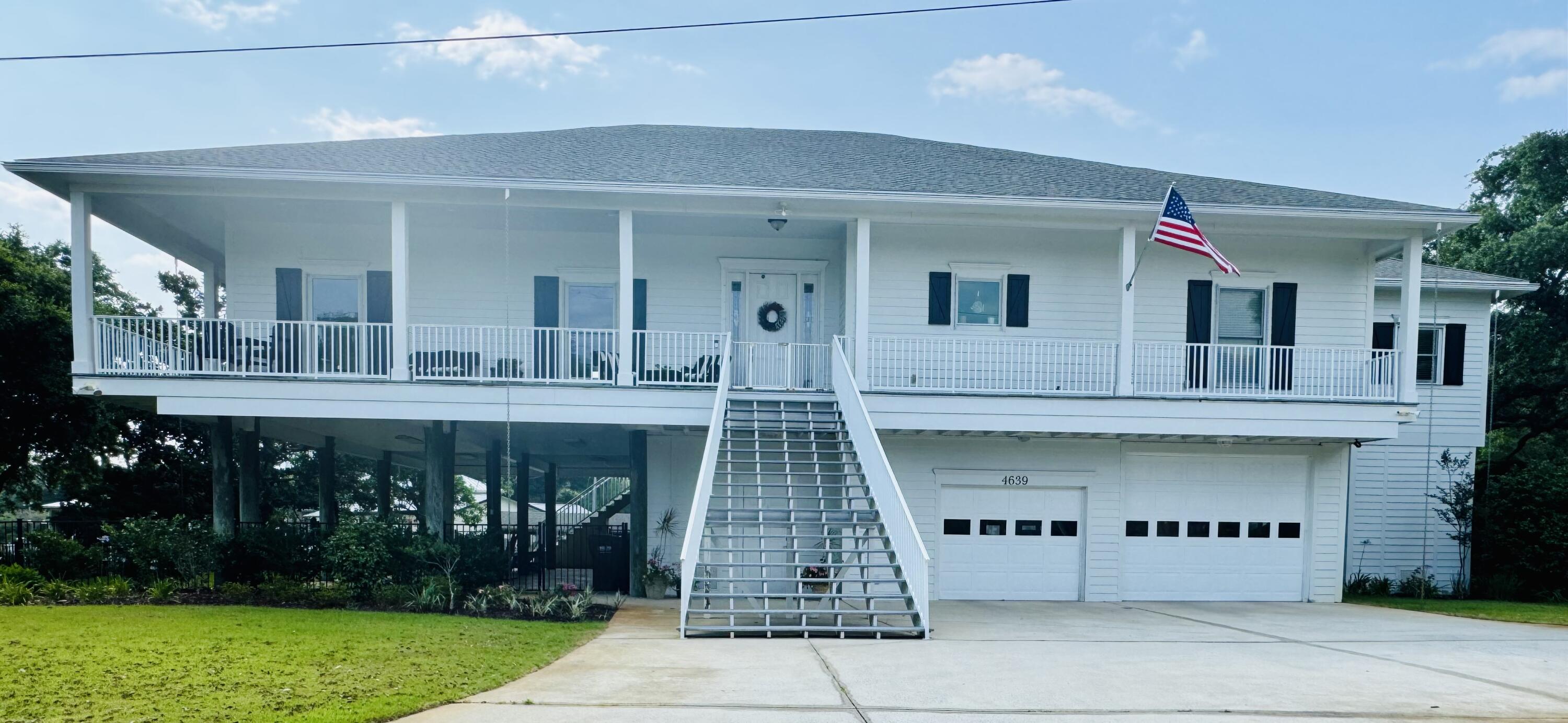 Coming Soon! Tucked away at the end of a cul-de-sac, this stunning waterfront retreat offers the perfect blend of privacy & breathtaking views. Enjoy views of the Sound and Bayou from every angle of this elevated, open-concept masterpiece. Step inside to find a gourmet kitchen designed to impress, complete with high-end finishes. The spacious living areas flow seamlessly, framed by expansive windows that invite the water views in. An elevator provides effortless access, while the outdoor spaces are an entertainer's dream--featuring a wrap-around porch, a large screened-in area, and low-maintenance trex type decking. Whether relaxing or hosting a lively gathering, you'll savor every moment of this peaceful escape. For the boating enthusiast, a private covered boat lift awaits!