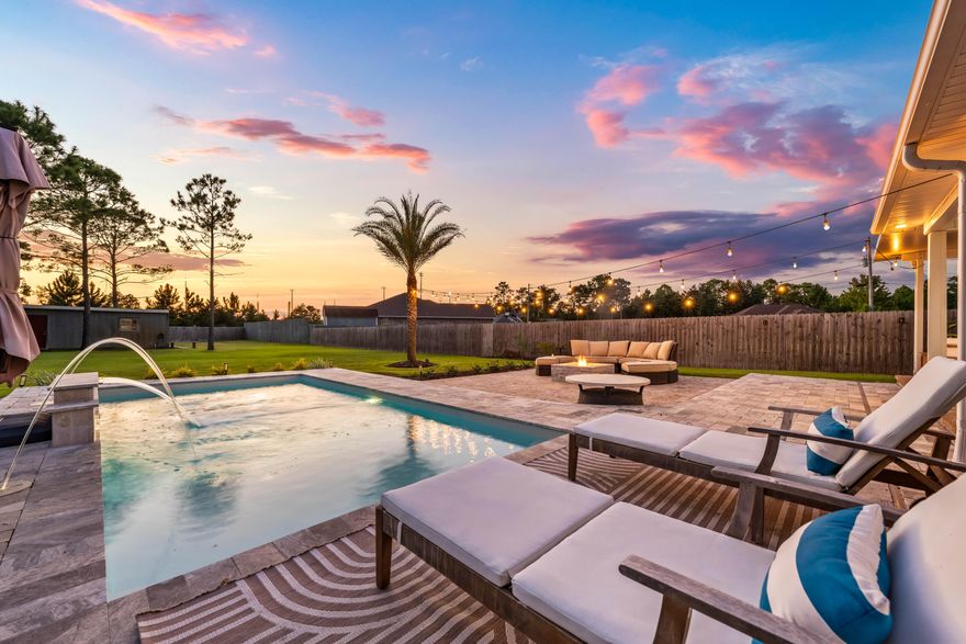 Weekends feel like a getaway in this resort-inspired backyard, where $130,000 in enhancements created a heated fiberglass pool that shimmers beside elegant decking, a firepit for evening gatherings, and an extended covered patio for shaded afternoons. Towering palms and manicured landscaping complete the scene, offering a private escape without ever leaving home. Inside, the four-bed, two-bath home, built in 2020 by Lonnie King Construction, flows with ease thanks to an open floor plan designed for connection, whether it's entertaining friends or enjoying a quiet family dinner. Natural light fills each room, creating a warm, welcoming atmosphere that complements the home's thoughtful design. On nearly half an acre with no HOA, the property offers freedom and functionality. A fully fenced yard with a 17-foot gate allows RV or boat storage, while an oversized workshop with water and electricity expands possibilities for hobbies or projects. With an irrigation system to keep the grounds lush and a location close to schools, shopping, and dining, this home combines everyday convenience with a lifestyle that feels like a retreat. 
