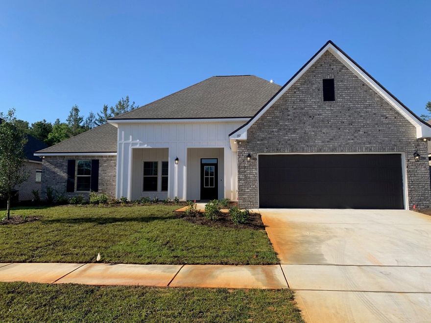 The JOHNSON IV G in The Trails at Hammock Bay community offers a 4 bed, 3 full bath, open and split design with a formal dining room, separate breakfast area, and a pocket office. Upgrades added (list attached).Special Features: double vanity, garden tub, separate tiled shower, and walk-in closet in master bath, master closet goes through to laundry, boot bench and drop zone in mud room, double vanity in 2nd bath, walk-in closets, built-in desk in the office, kitchen island, walk-in pantry, covered porch and patio, recessed lights, bronze plumbing fixtures, framed mirrors, smoke/carbon monoxide detectors, landscaping, architectural 30-year shingles, and more!Energy Efficient Features: tankless gas water heater, kitchen appliance package with gas range, low E MI windows, and more!