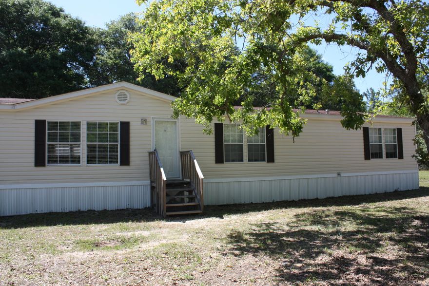 COMPLETELY RENOVATED, 4 BEDROOM, 3 BATH HOME ON HALF ACRE LOT! Looks like a model home! Split floor plan. Has beautiful kitchen with large island and black appliances, formal dining area with french doors leading to new back deck, adjacent large bonus room, separate laundry with backyard access, Master bath with Jacuzzi tub and separate shower, walk in closets, Jack and Jill bath between 2 bedrooms, and 3 piece hall guest bath, and a fourth bedroom which could easily be used as an office. New carpet throughout. Back yard is fenced. Potting shed with running water a bonus for gardeners. Come see today! Buyer to verify all dimensions.
