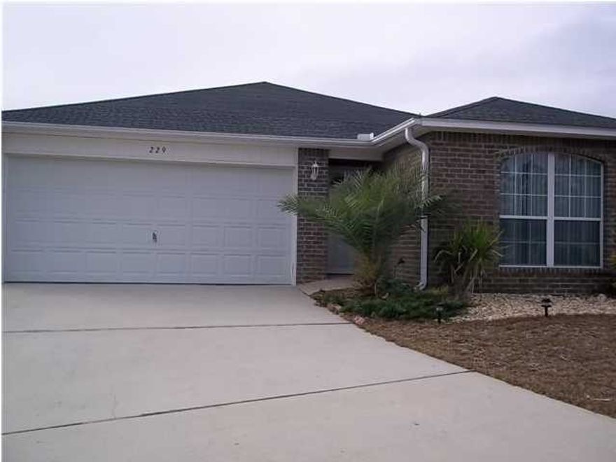 AVAIL: 4/10. FLEXIBLE S/D = TO 1 MO. RENT CAN BE MADE IN 2 MO. INSTALLMENTS IF QUALIFIED. PETS ALLOWED UPON OWNERS APPROVAL & W/ A $250-500 NON-REFUNDABLE PET FEE DEPENDING ON PETS! Beautiful home in the middle of Crestview! Granite galore! Granite counter tops in the kitchen & baths along w/ granite/stone tile flooring throughout except for the bedrms! As you enter home you have 2 bedrms w/ carpet/fans/crown molding/vertical blinds off to your right. The hall full bathrm separates the 2 bedrms. Nice open living/kitchen/dining area w/ cathedral ceilings/plant ledges/recessed lighting/crown molding/textured walls/a granite surround wood burning fireplace. 2 dining areas. Kitchen features a bkfast bar area w/ wine rack/pantry/granite tiled back splash/cherry wood cabinets w/ stainless steel handles & all the appliances in place! Split bedrm plan for extra privacy. Great master suite w/ recessed lighting/ceiling fan/crown molding/double vanity sinks/garden tub & 2 walk in closets. Open patio off back of home great for relaxing/entertaining. Yard building stays for your lawn equipment. Inside utility rm w/ shelving. 2 car garage w/ auto garage door opener & pull down stairs for storage. Home also features rain gutters & has a tiled/covered front entrance. Nice tropical landscape w/ lighting. Close & convenient to Eglin AFB, hospital, shopping, restaurants, schools, etc. No smoking inside home! Call to see today!